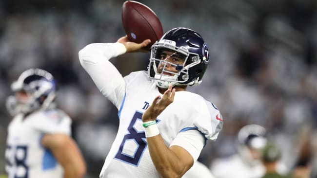 November 05, 2018:.Tennessee Titans quarterback Marcus Mariota (8)  scrambles for a first down during an NFL football game between the  Tennessee Titans and Dallas Cowboys at AT&T Stadium in Arlington, Texas.  Manny