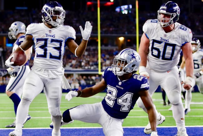 November 05, 2018:.Tennessee Titans quarterback Marcus Mariota (8)  scrambles for a first down during an NFL football game between the  Tennessee Titans and Dallas Cowboys at AT&T Stadium in Arlington, Texas.  Manny