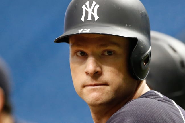 New York Yankees batter Chase Headley runs to first as he watches