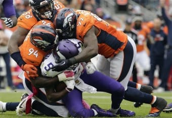 Seattle Seahawks running back Mashawn Lynch (R) breaks a tackle by Chicago  Bears safety Chris Harris as he scores on a 1-yard touchdown run during the  fourth quarter at Soldier Field in
