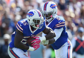 San Diego Chargers tackle King Dunlap (77) blocks Buffalo Bills cornerback  Nickell Robey (37) as teammate Eddie Royal (11) breaks away from Jarius  Wynn (92) to score a touchdown during the first