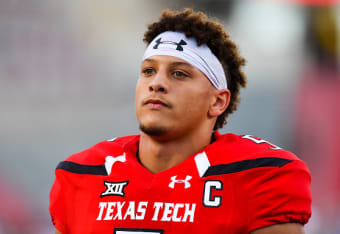 Patrick Mahomes Texas Tech Red Raiders Unsigned White Jersey Signaling A Play Photograph