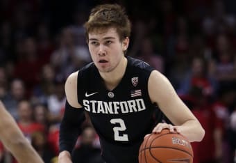 Stanford center Josh Sharma (20) reacts next to guard Marcus Allen