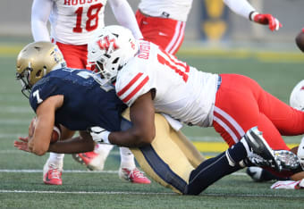 North defensive end John Cominsky of Charleston (5) tries to get around  South offensive tackle Dennis Daley of South Carolina (78) during the  second half of the Senior Bowl college football game