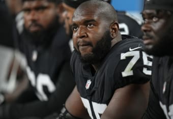 Raiders defensive tackle Quinton Jefferson (77) tackles Denver Broncos  running back Javonte Wil …