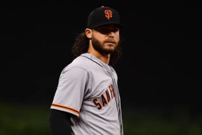 Brandon Crawford plays on amid family grief