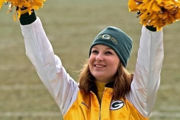 A Green Bay Packers cheerleader is seen before an NFL football