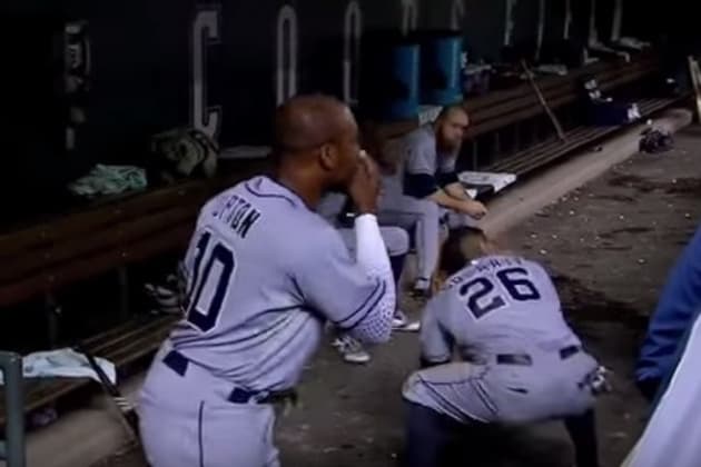 Alonso wears catcher's gear in the dugout 