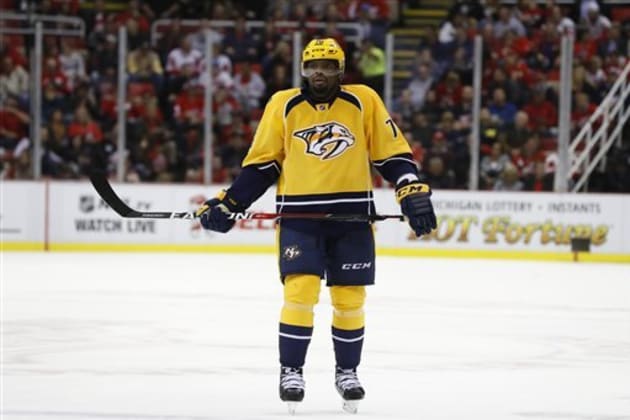 Nashville Predators defenseman P.K. Subban, center, wears a cowboy hat as  he and his teammates warm up in Hockey Fights Cancer jerseys before an NHL  hockey game against the Washington Capitals Tuesday
