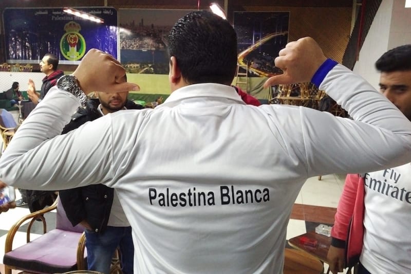 A Palestina Blanca prepares to watch his beloved Real Madrid play.