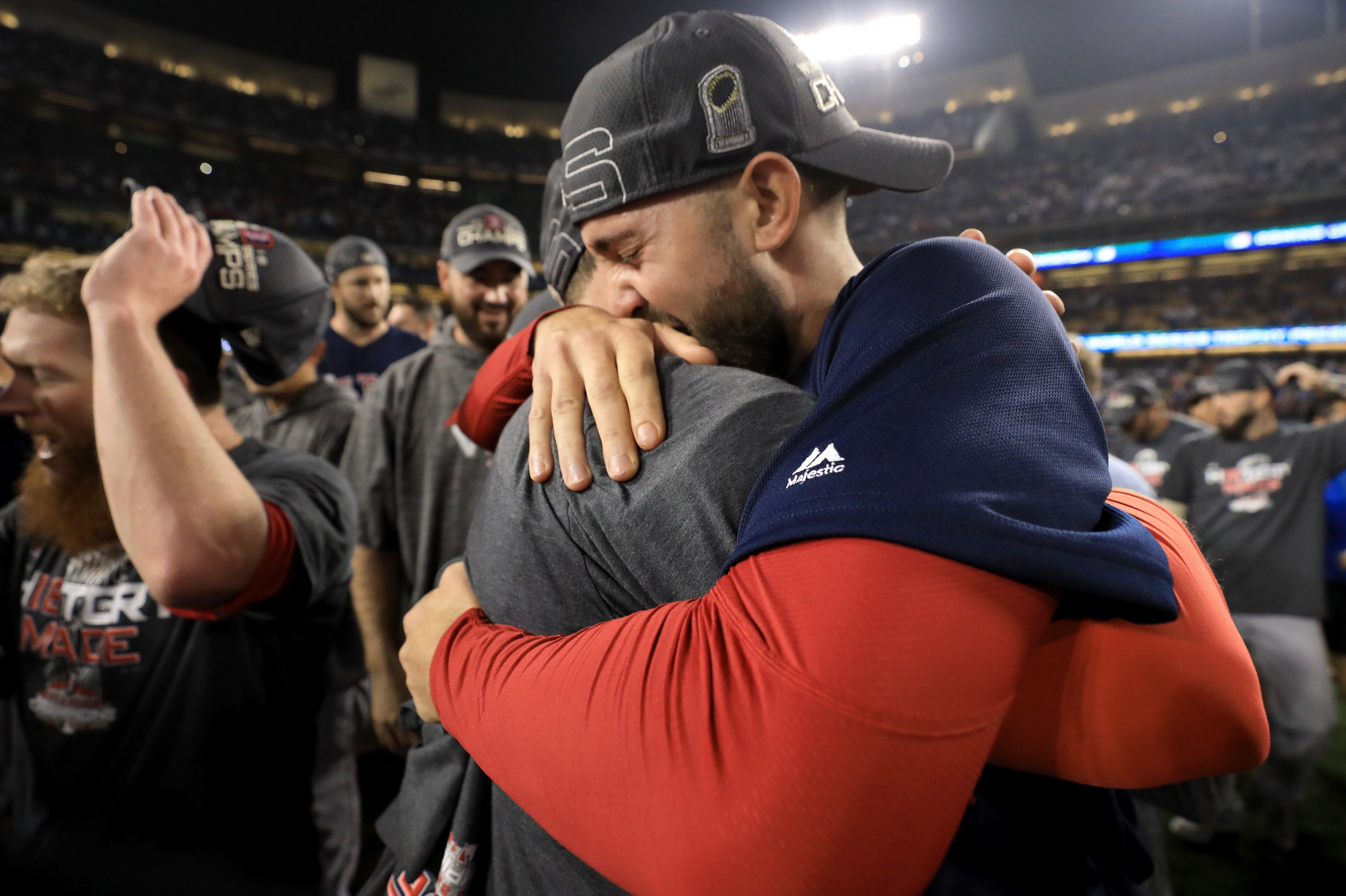 LOS ANGELES, CA - OCTOBER 28: Hector Velazquez and Rick Porcello #22 of the Boston Red Sox celebrate with their team's 5-1 win over the Los Angeles Dodgers in Game Five of the 2018 World Series at Dodger Stadium on October 28, 2018 in Los Angeles, California. (Photo by Sean M. Haffey/Getty Images)