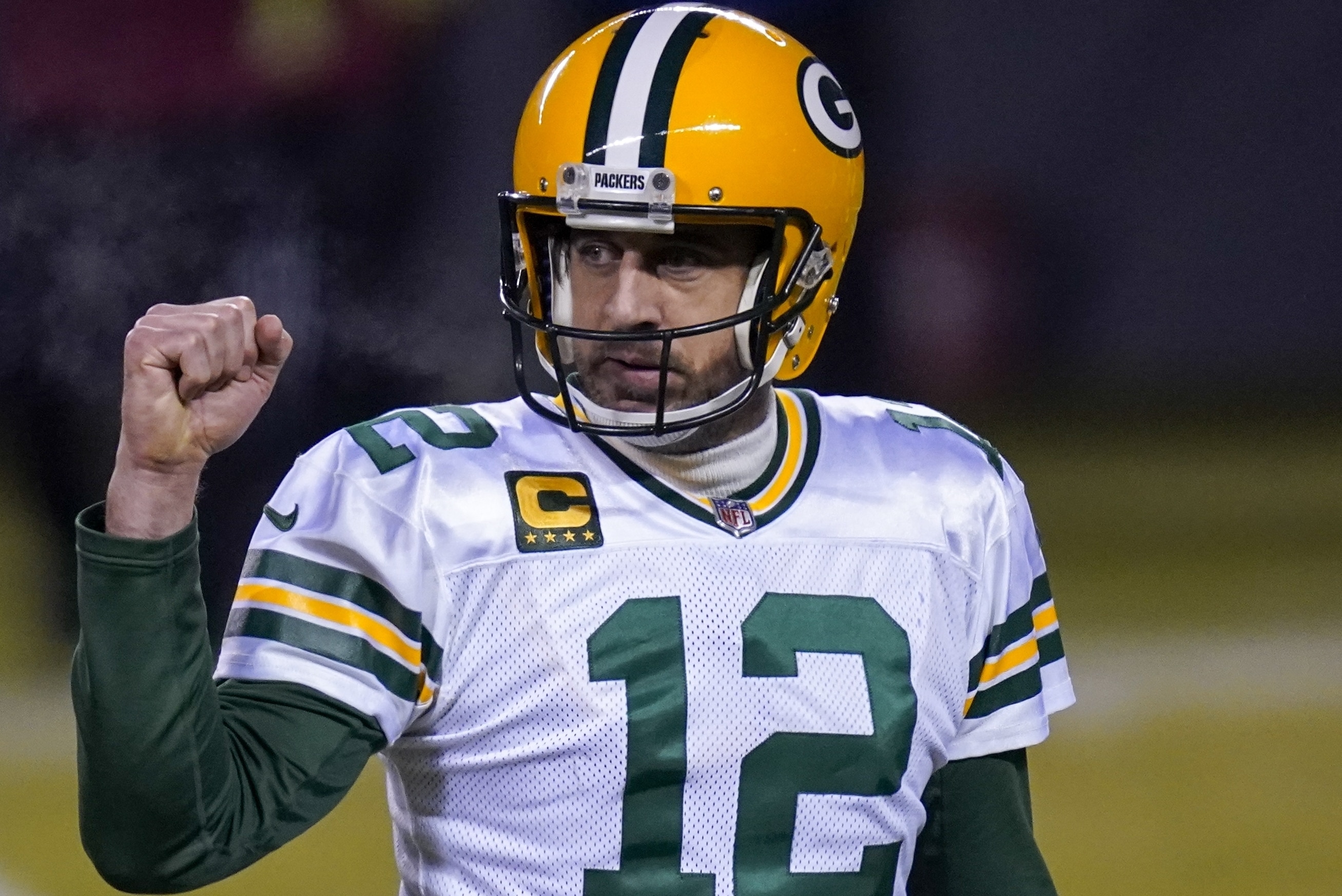 Green Bay Packers' Aaron Rodgers reacts during the second half of an NFL football game against the Chicago Bears Sunday, Jan. 3, 2021, in Chicago. (AP Photo/Charles Rex Arbogast)