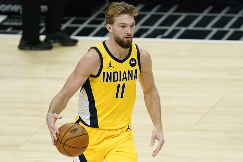 Indiana Pacers forward Domantas Sabonis (11) controls the ball during the fourth quarter of an NBA basketball game against the Los Angeles Clippers Sunday, Jan. 17, 2021, in Los Angeles. (AP Photo/Ashley Landis)