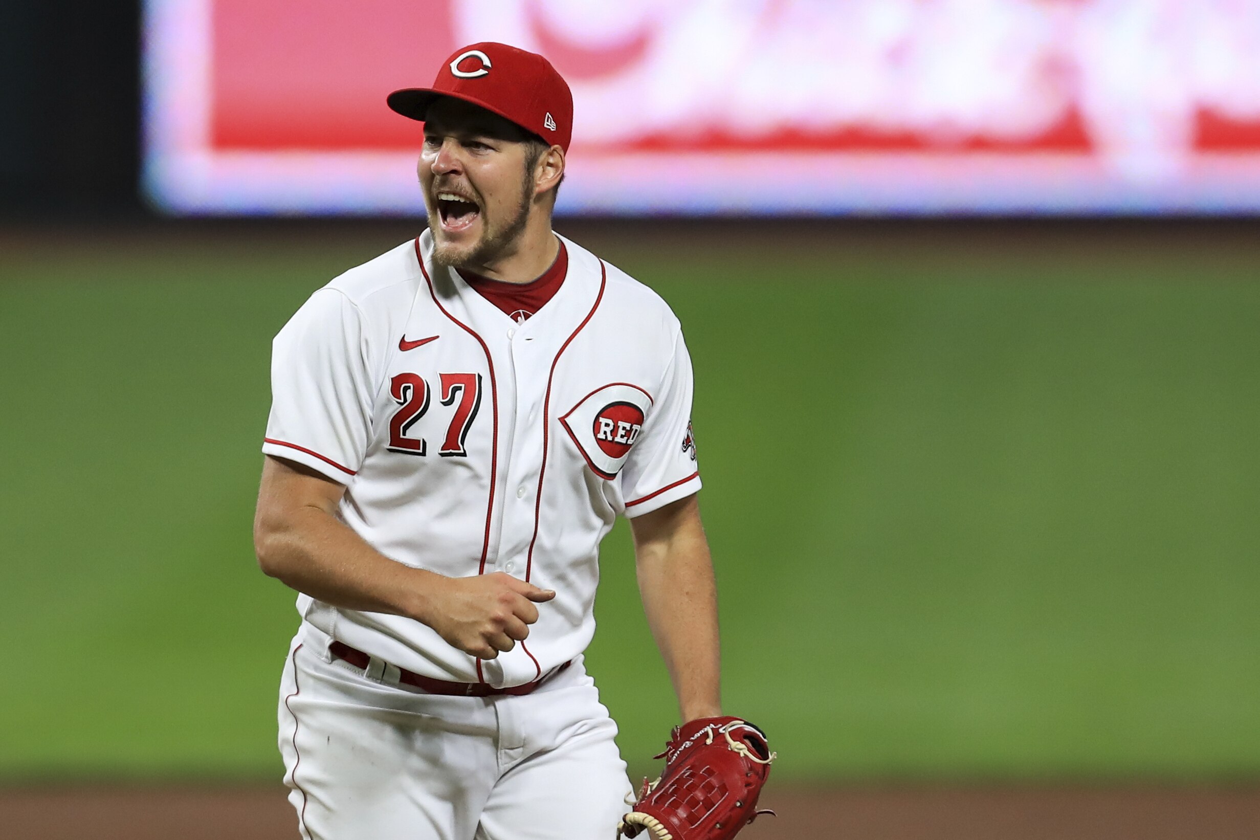 Cincinnati Reds' Trevor Bauer reacts after recording a strikeout against Milwaukee Brewers' Christian Yelich during a baseball game in Cincinnati, Wednesday, Sept. 23, 2020. The Reds won 6-1. (AP Photo/Aaron Doster)