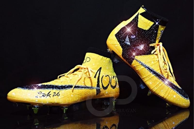 gold colour football boots