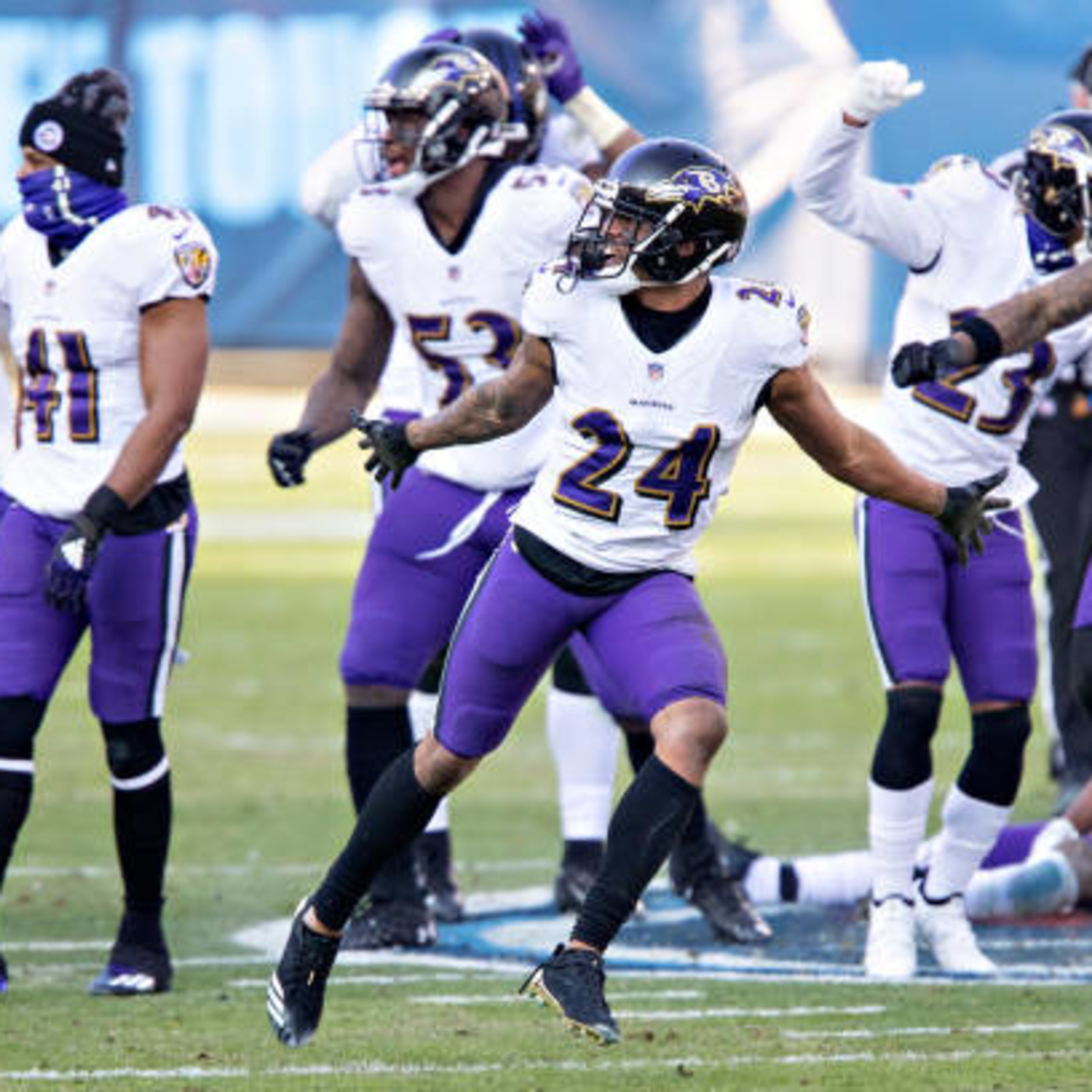 Ravens players dance on Titans' logo after fourth-quarter INT