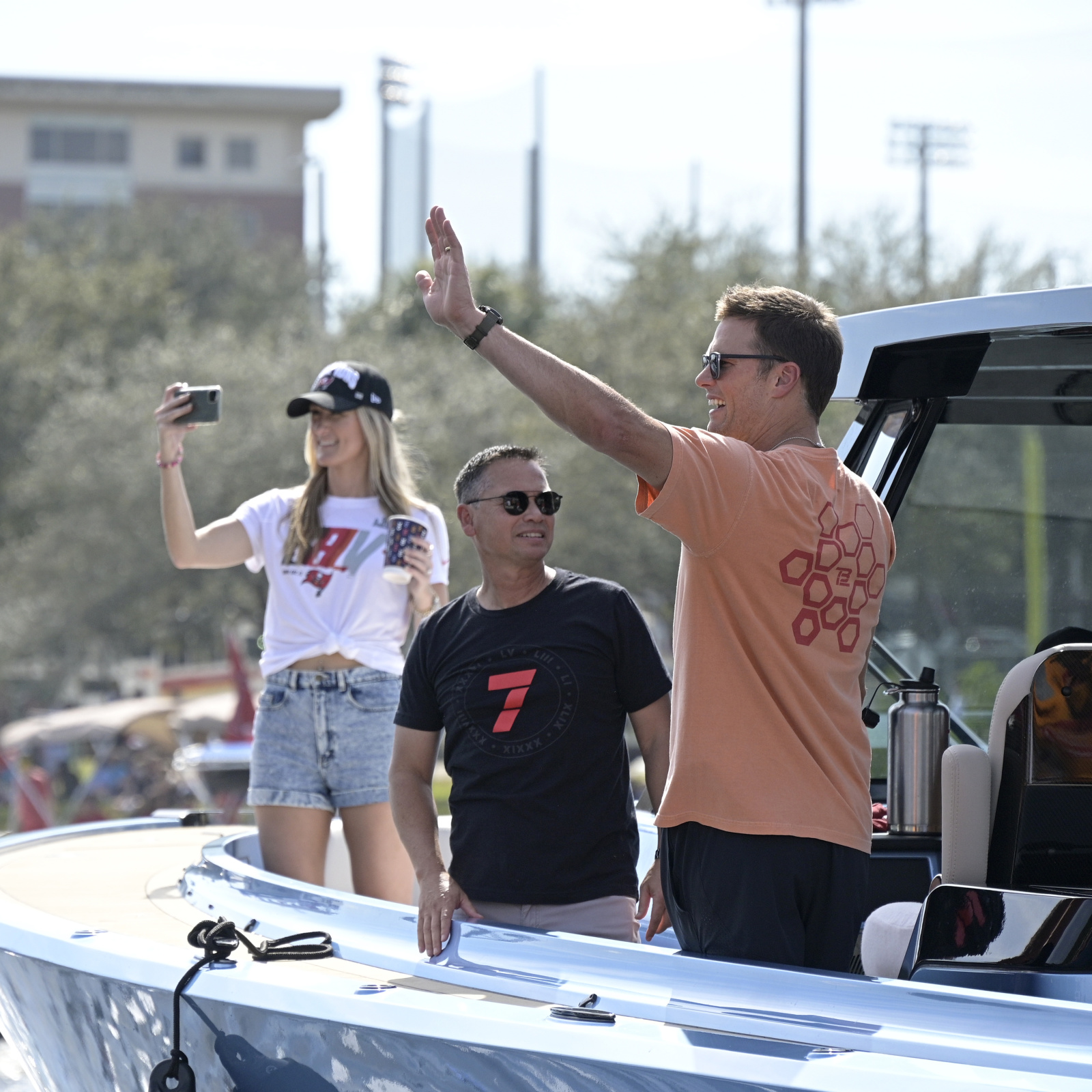 Watch Tom Brady toss Lombardi Trophy from one boat to another