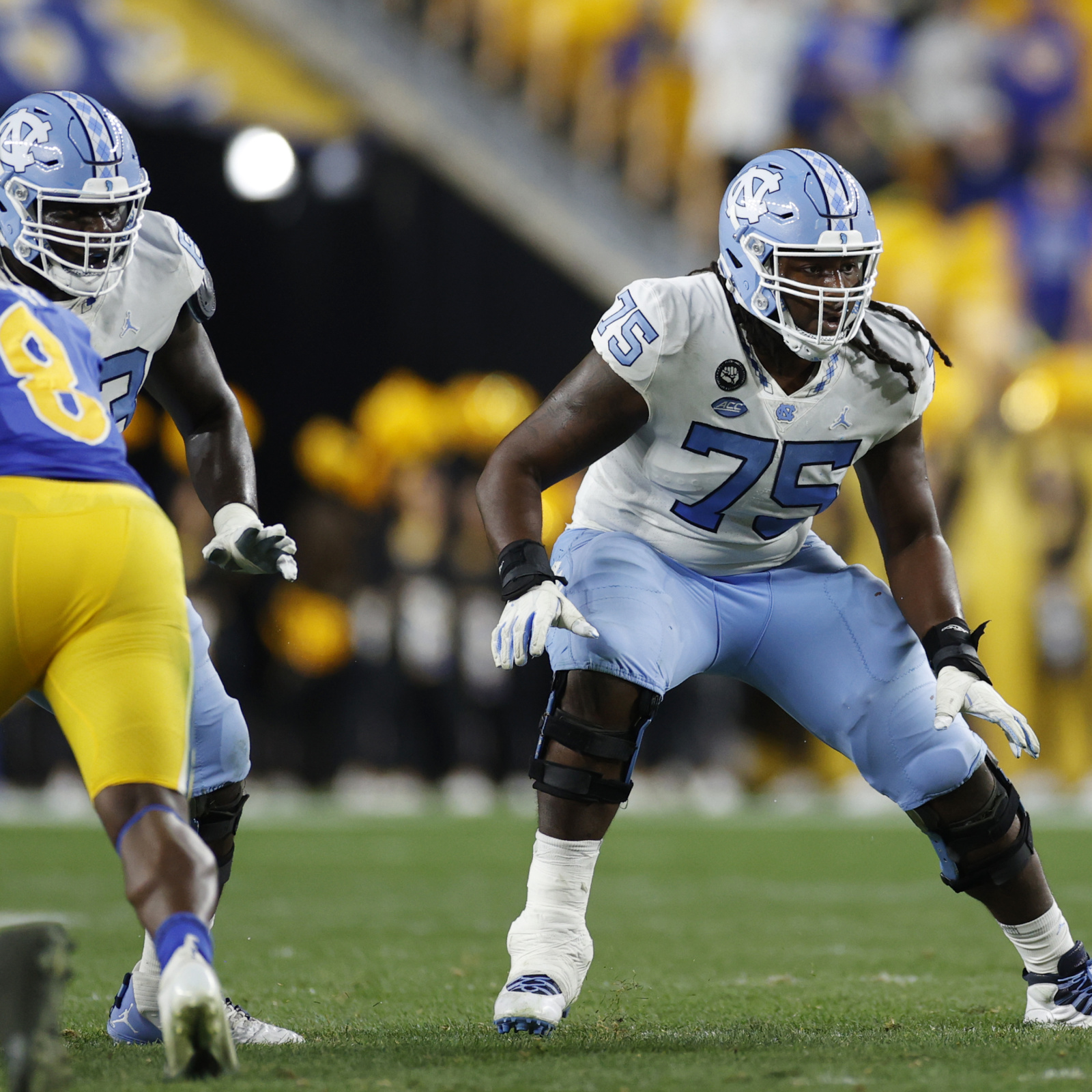 New York Giants guard Joshua Ezeudu looks to block against the New