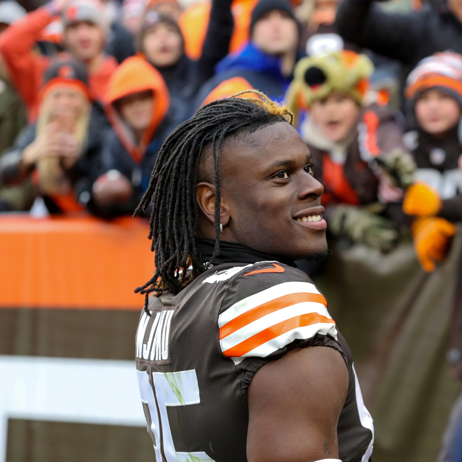 Cleveland Browns tight end David Njoku arrives at game in beige mask before  donning a balaclava to warm up after suffering burn injuries to his face  this week but still suits up