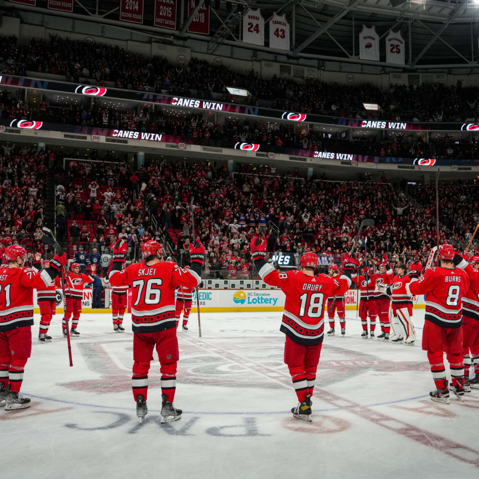 Carolina Hurricanes players celebrate after defeating the