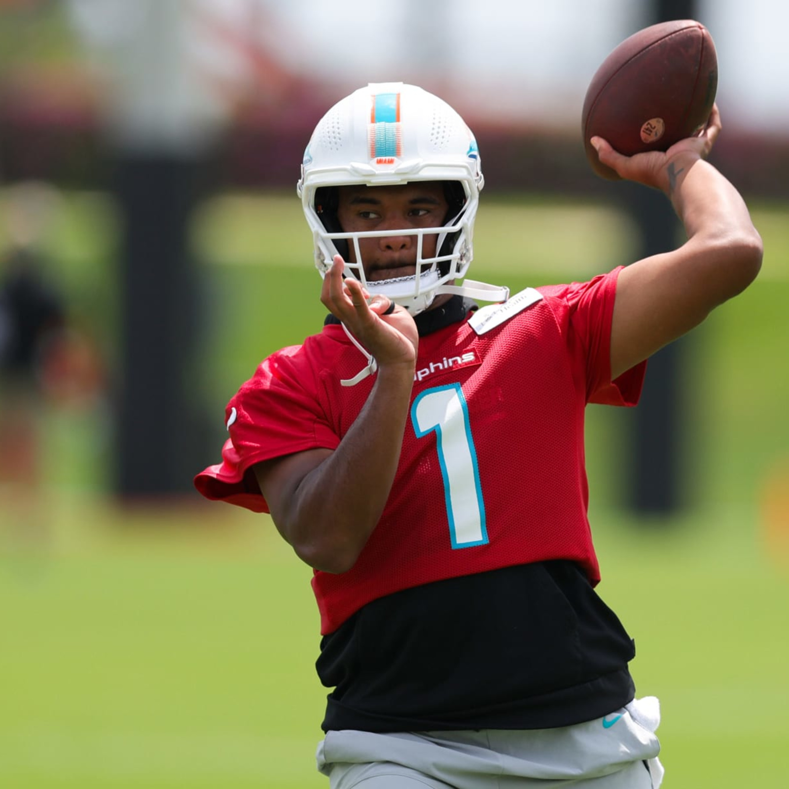 Miami Dolphins quarterback Tua Tagovailoa (1) wears a Crucial