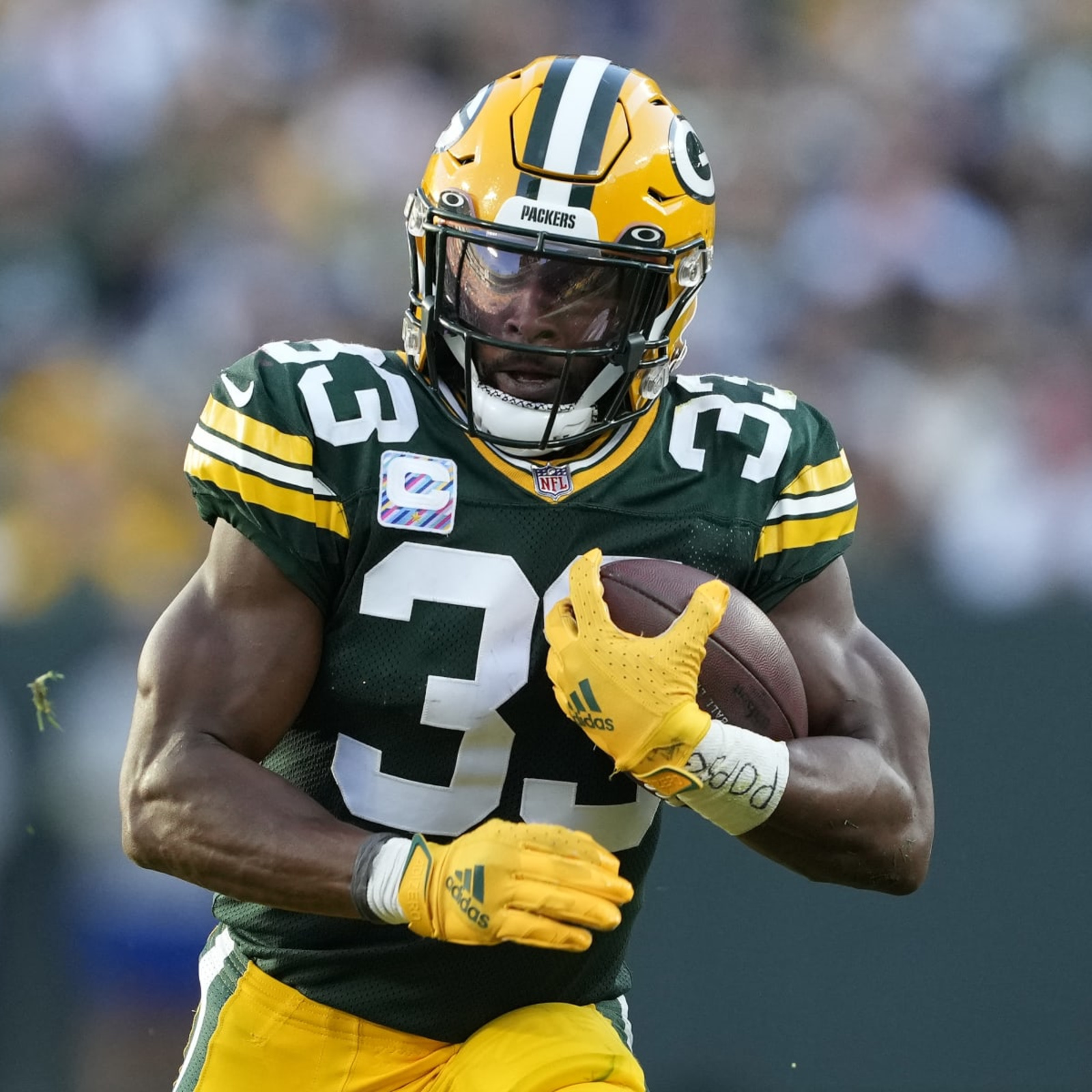 Aaron Jones of the Green Bay Packers avoids a tackle by Troy Hill of  News Photo - Getty Images