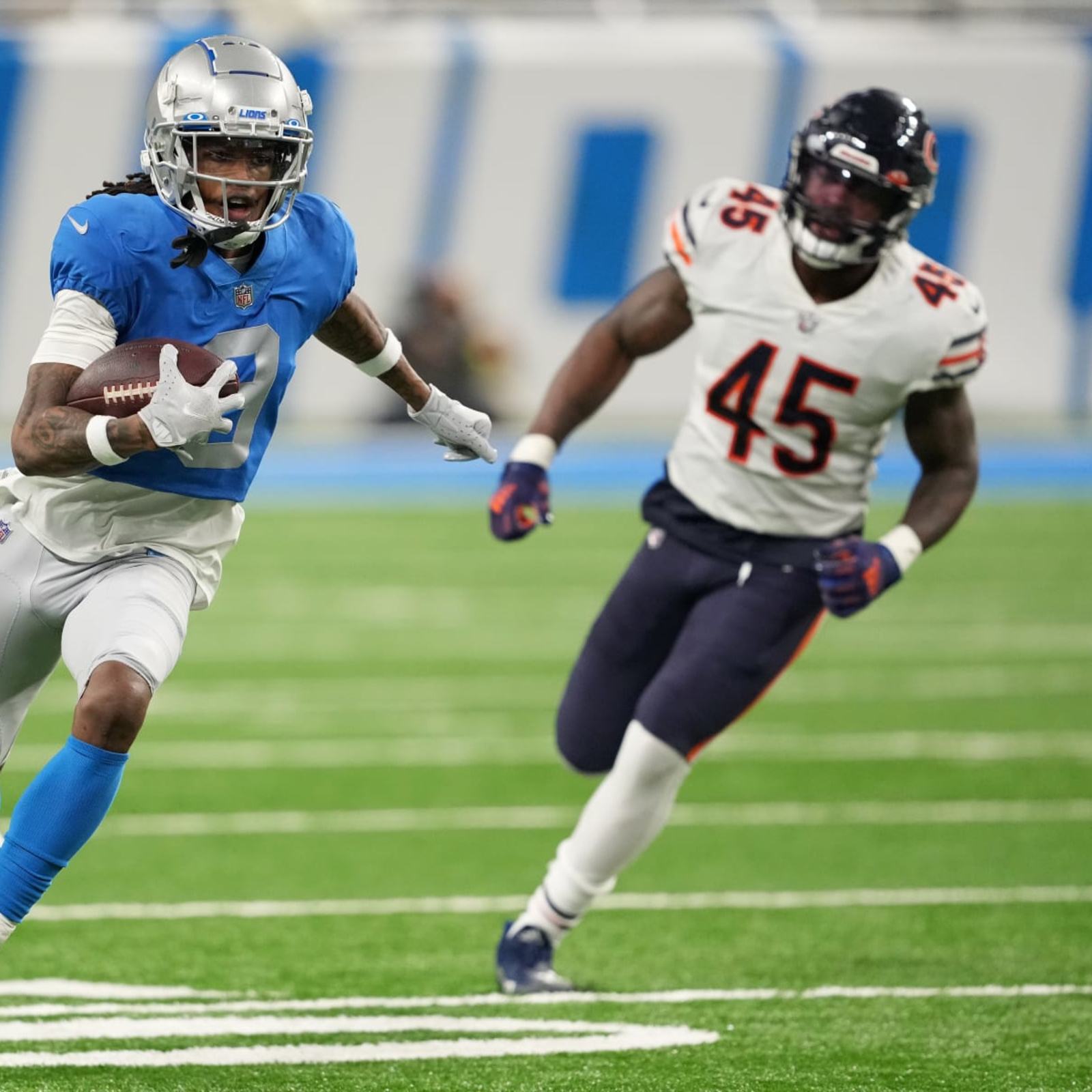 Detroit Lions' Jameson Williams catches a touchdown pass during