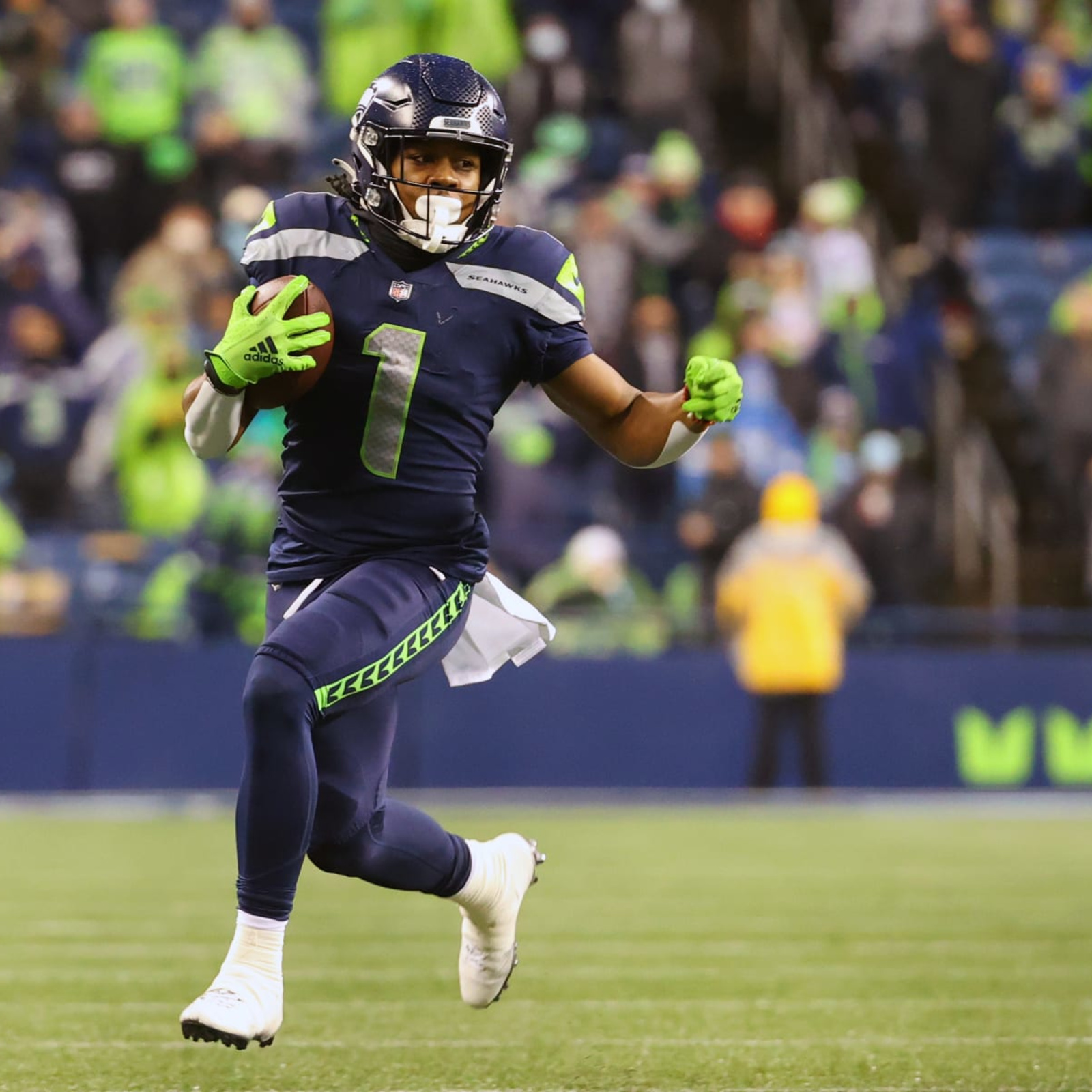 Seattle Seahawks wide receiver D'Wayne Eskridge (1) runs with the ball  during the second half of an NFL football game against the Green Bay  Packers, Sunday, Nov. 14, 2021, in Green Bay