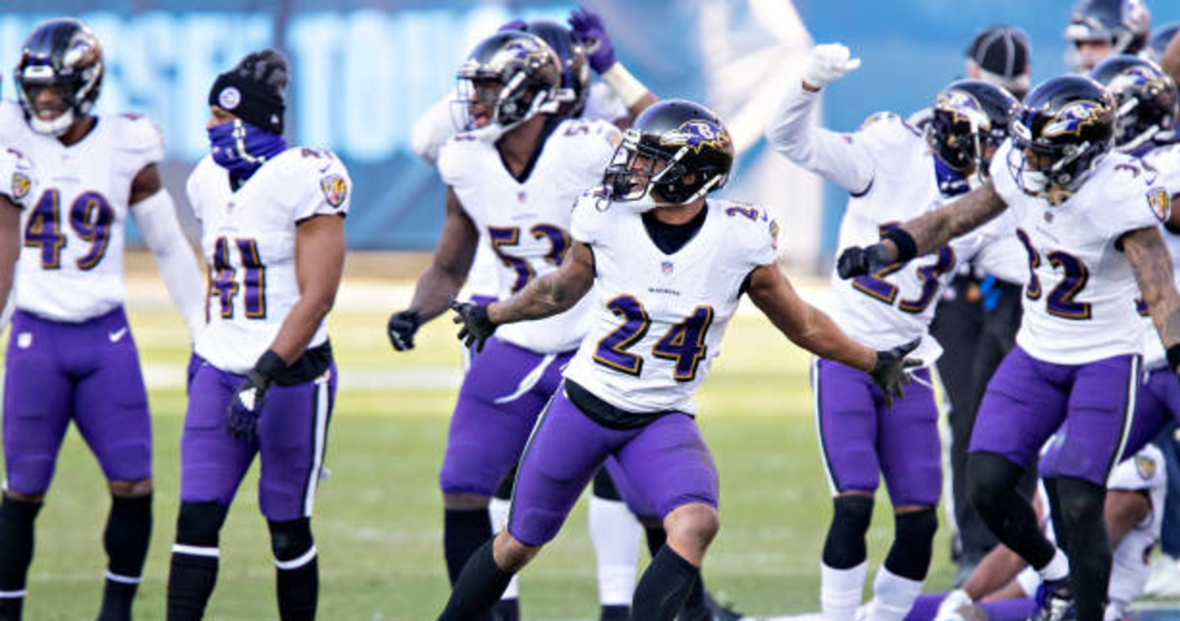 Ravens players dance on Titans' logo after fourth-quarter INT