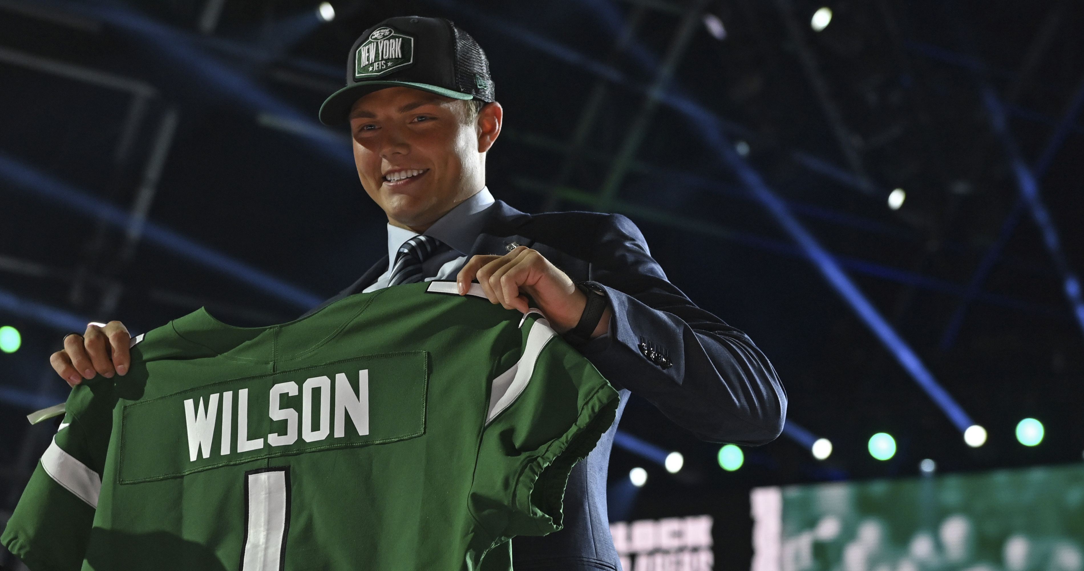 BYU quarterback Zach Wilson holds a New York Jets jersey with NFL