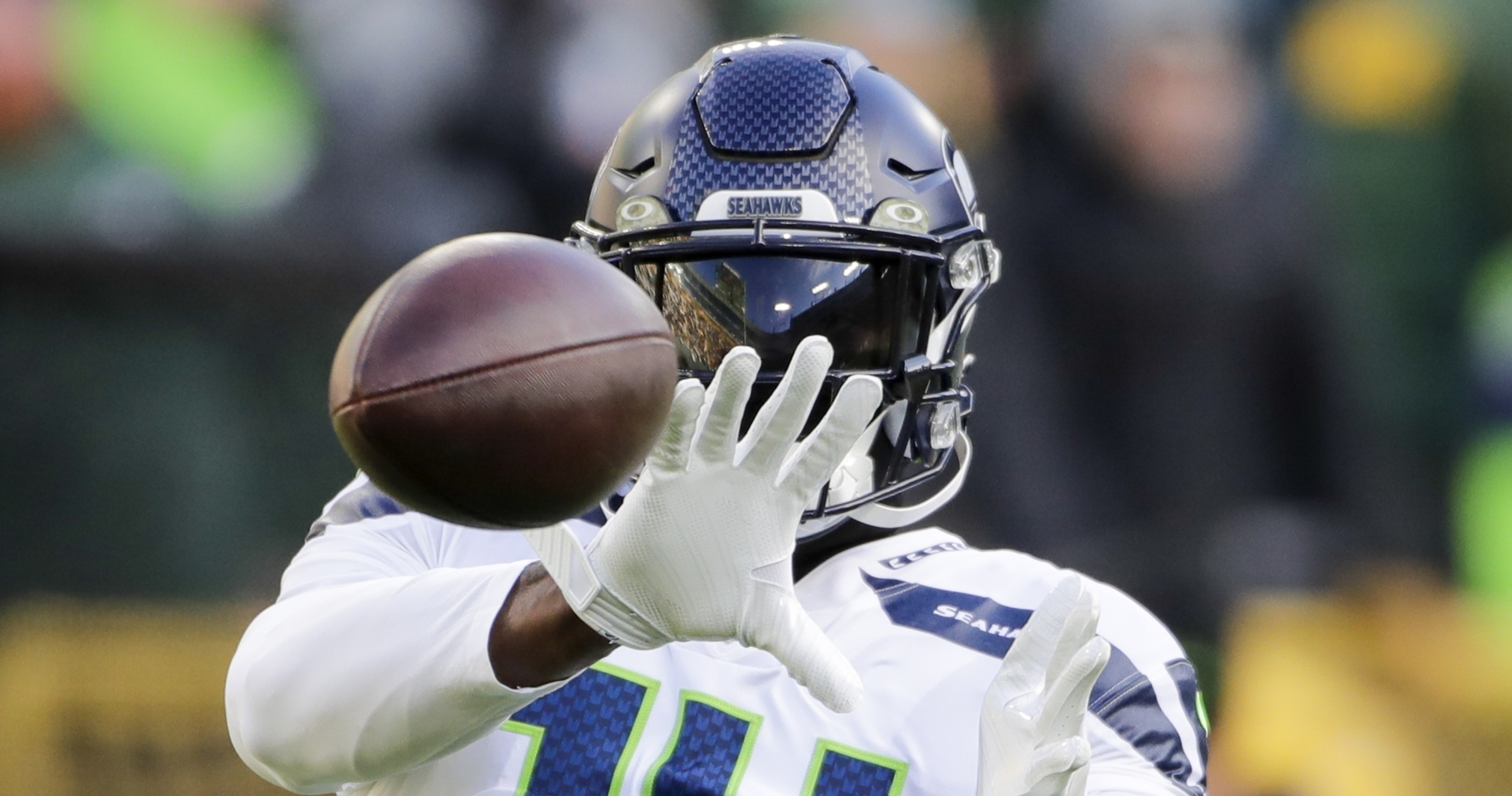 Seattle Seahawks defensive end Dre'Mont Jones (55) spikes the ball after a  teammate scored a touchdown during an NFL preseason game against the Green  Bay Packers Saturday, Aug. 26, 2023, in Green