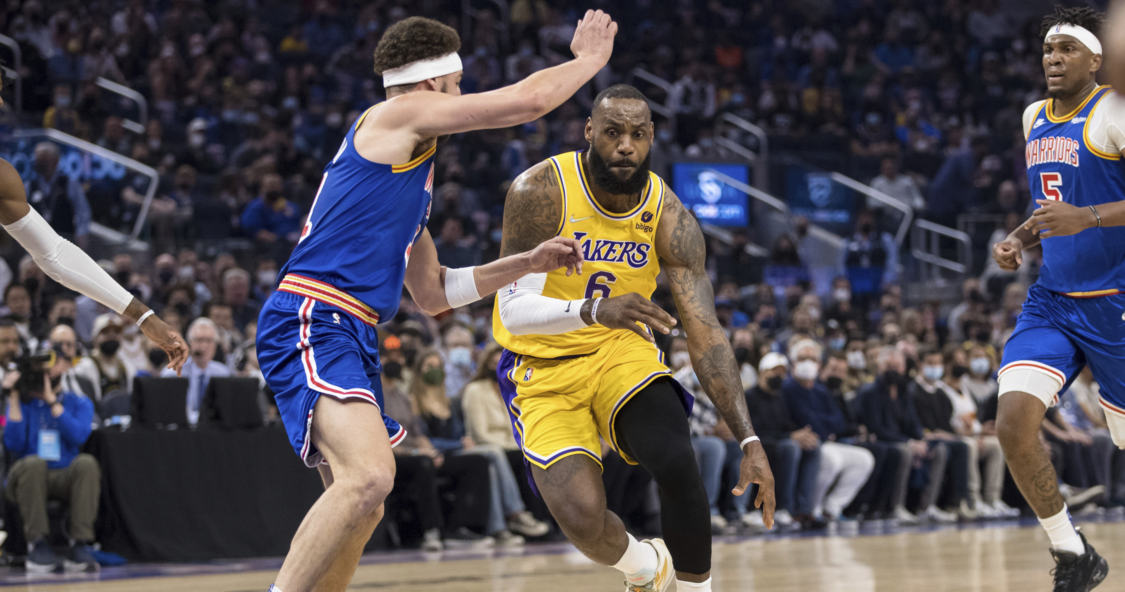 LeBron James makes history as Warriors edge Lakers 117-115