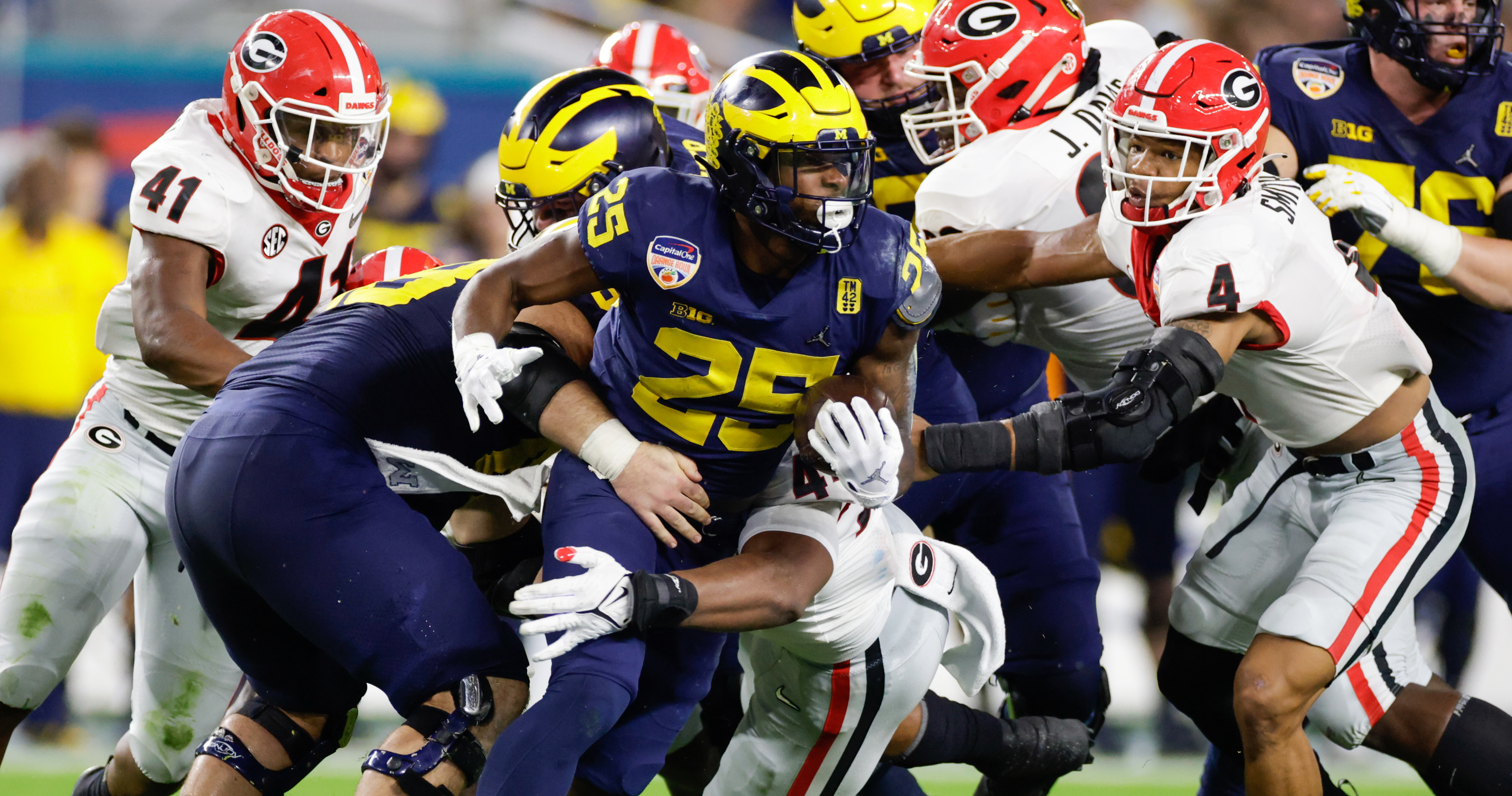 Former Michigan RB Hassan Haskins puts on Titans uniform at Panini's NFLPA  Rookie Premiere 