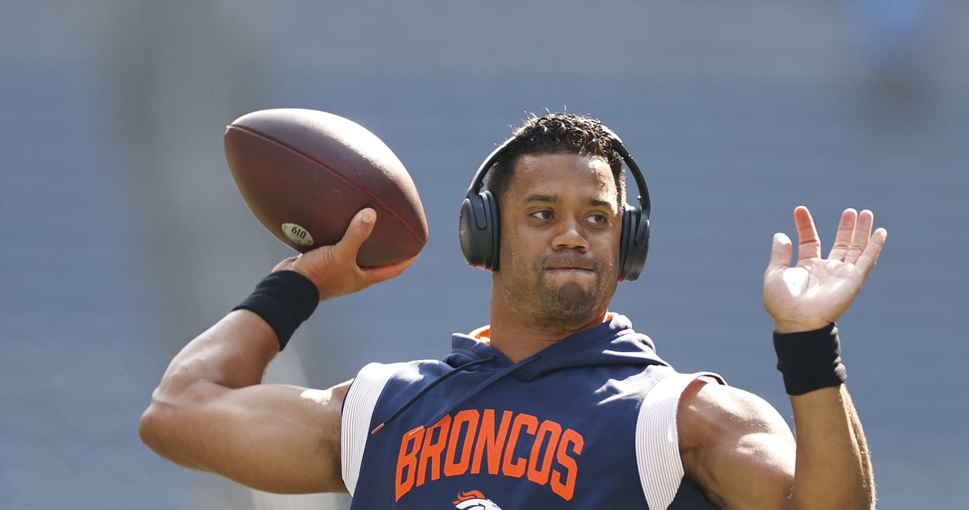 Denver Broncos quarterback Russell Wilson (3) greets, from left to