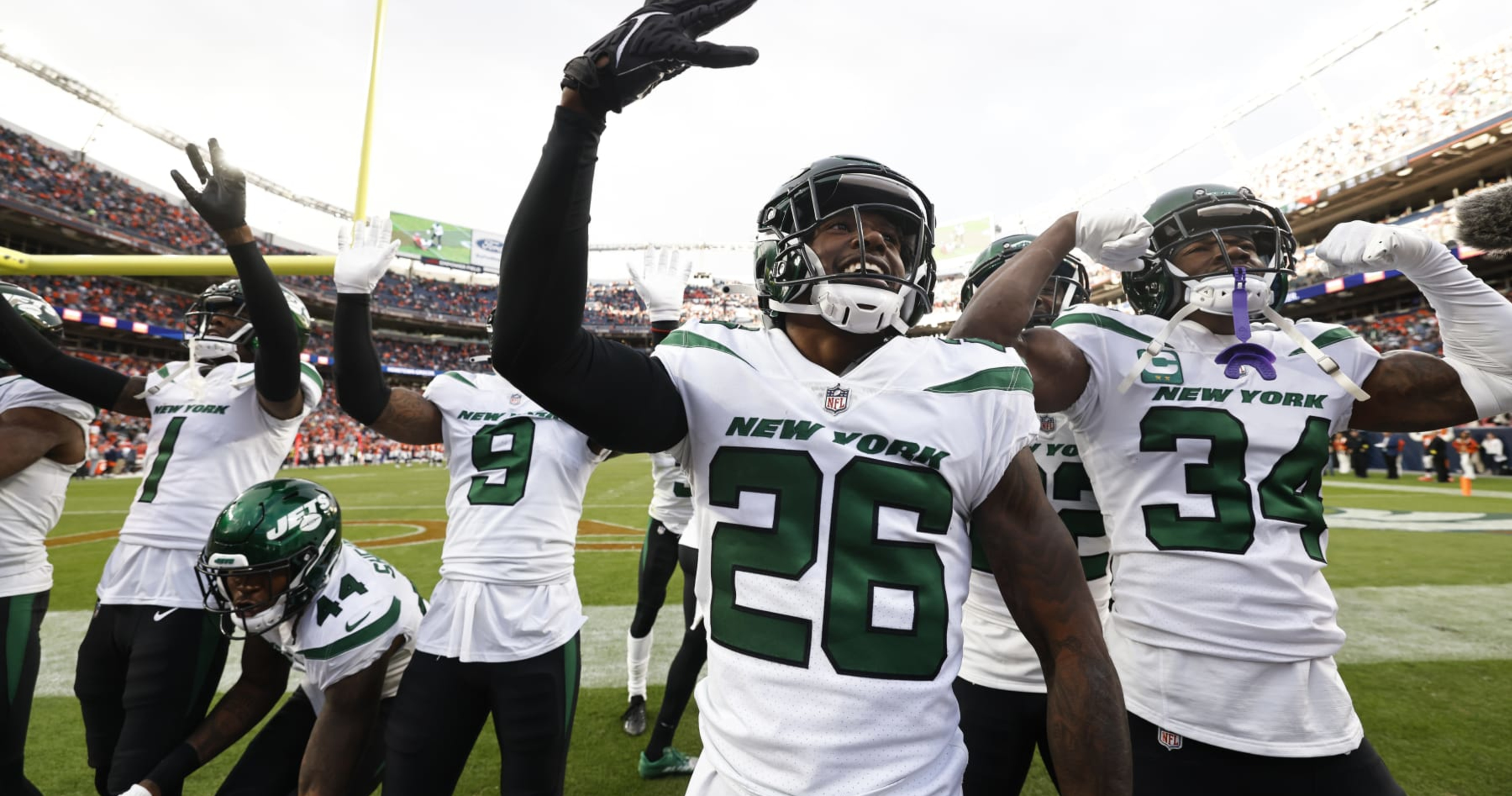 DENVER, CO - OCTOBER 23: New York Jets running back Michael Carter walks on  the sidelines before a NFL game between the New York Jets and the Denver  Broncos on October 23