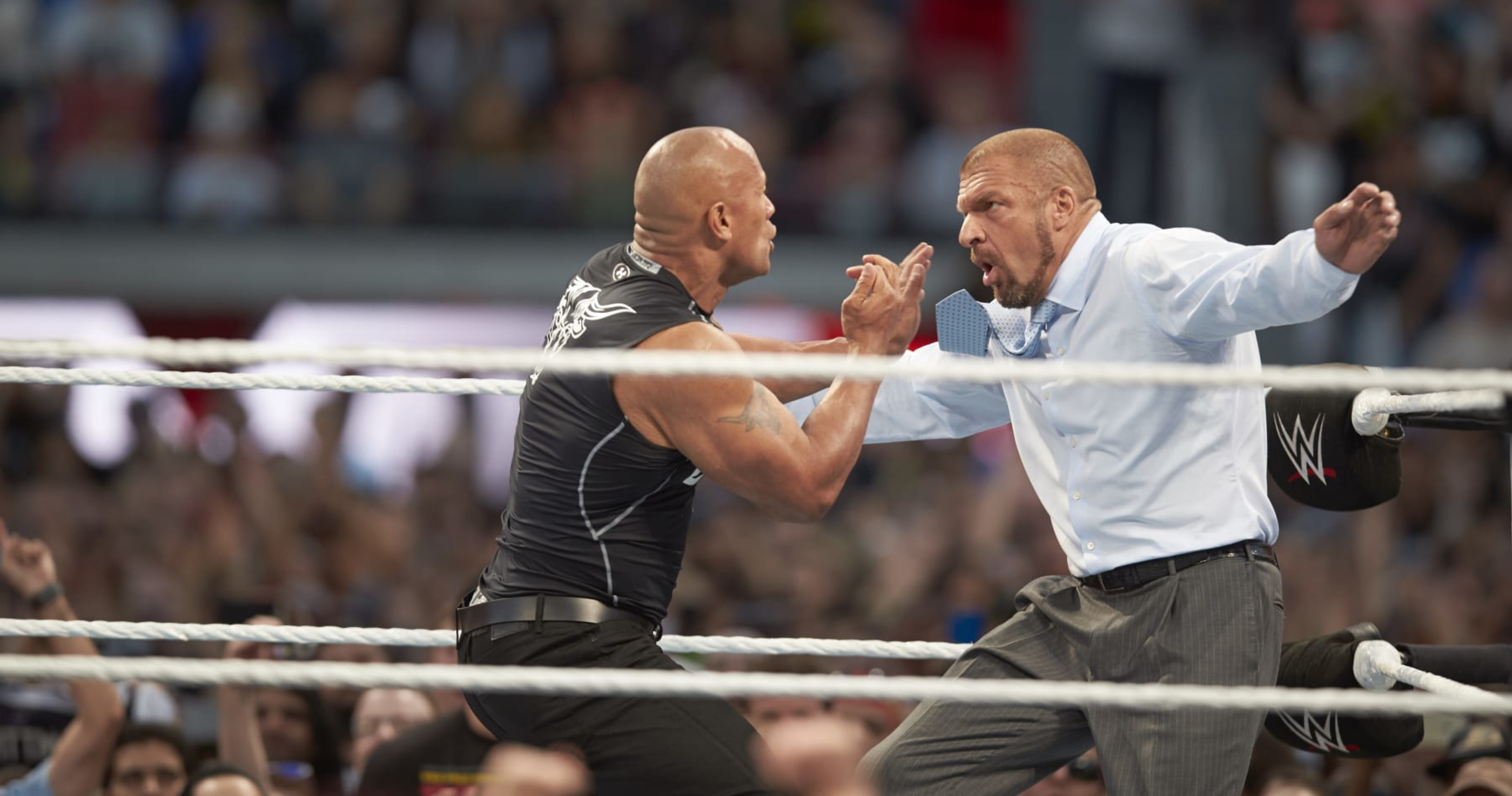 Triple H Comments On The Rock's WWE Future Amid Roman Reigns ...