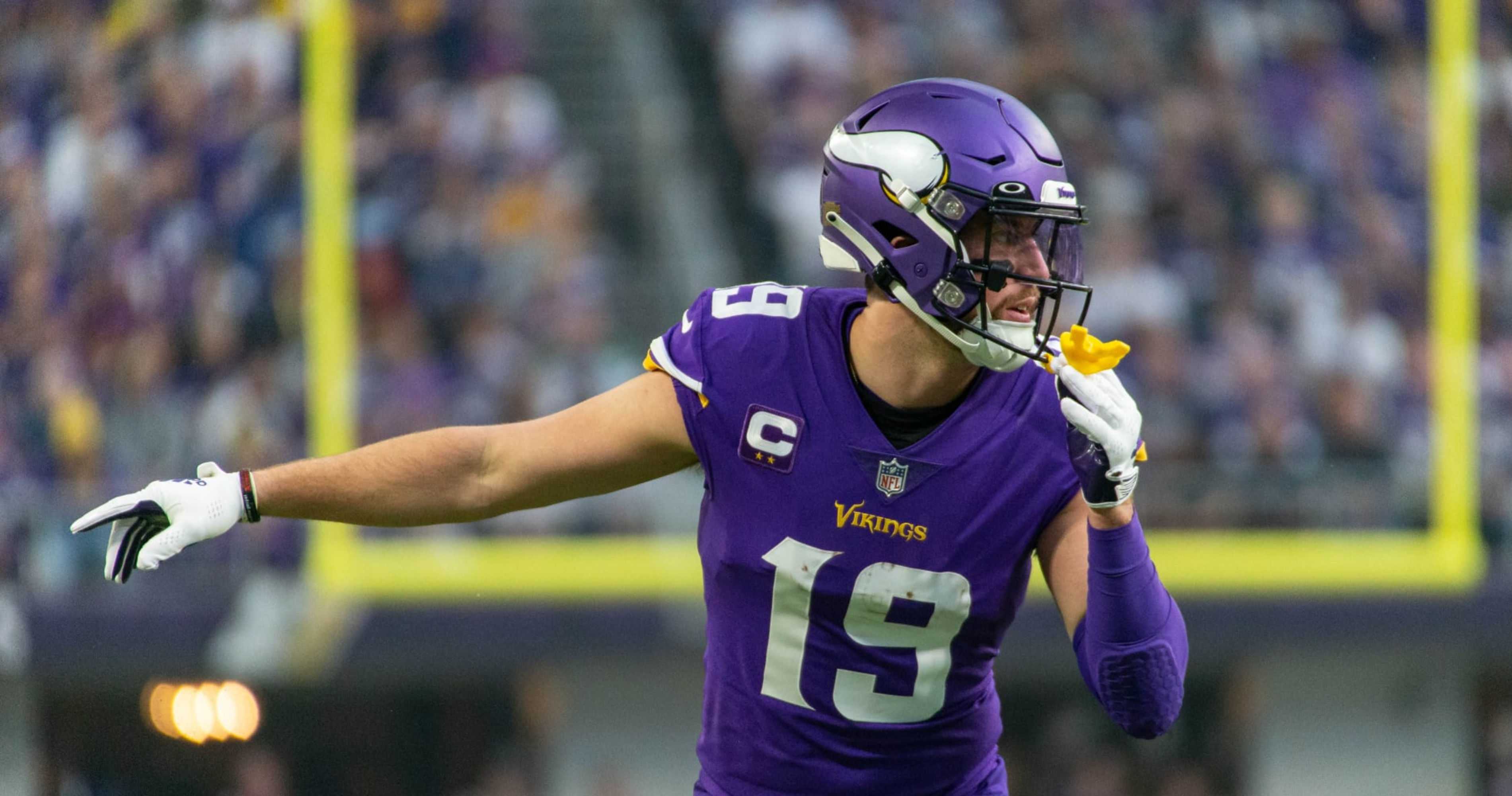 Minnesota Vikings wide receiver Adam Thielen (19) is greeted by