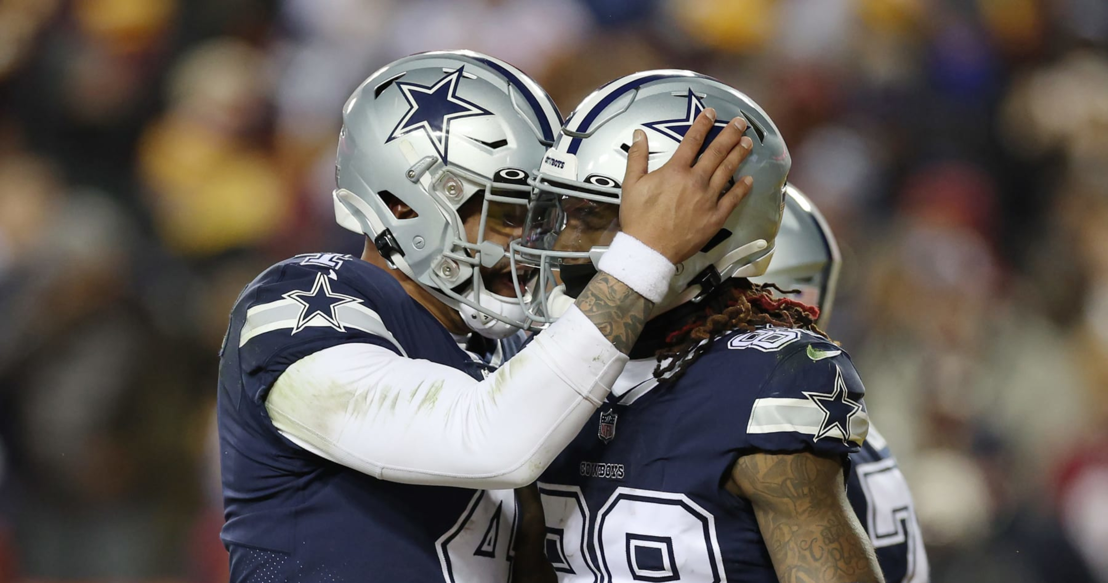 Dallas Cowboys' CeeDee Lamb (88), Dak Prescott (4) and Tony