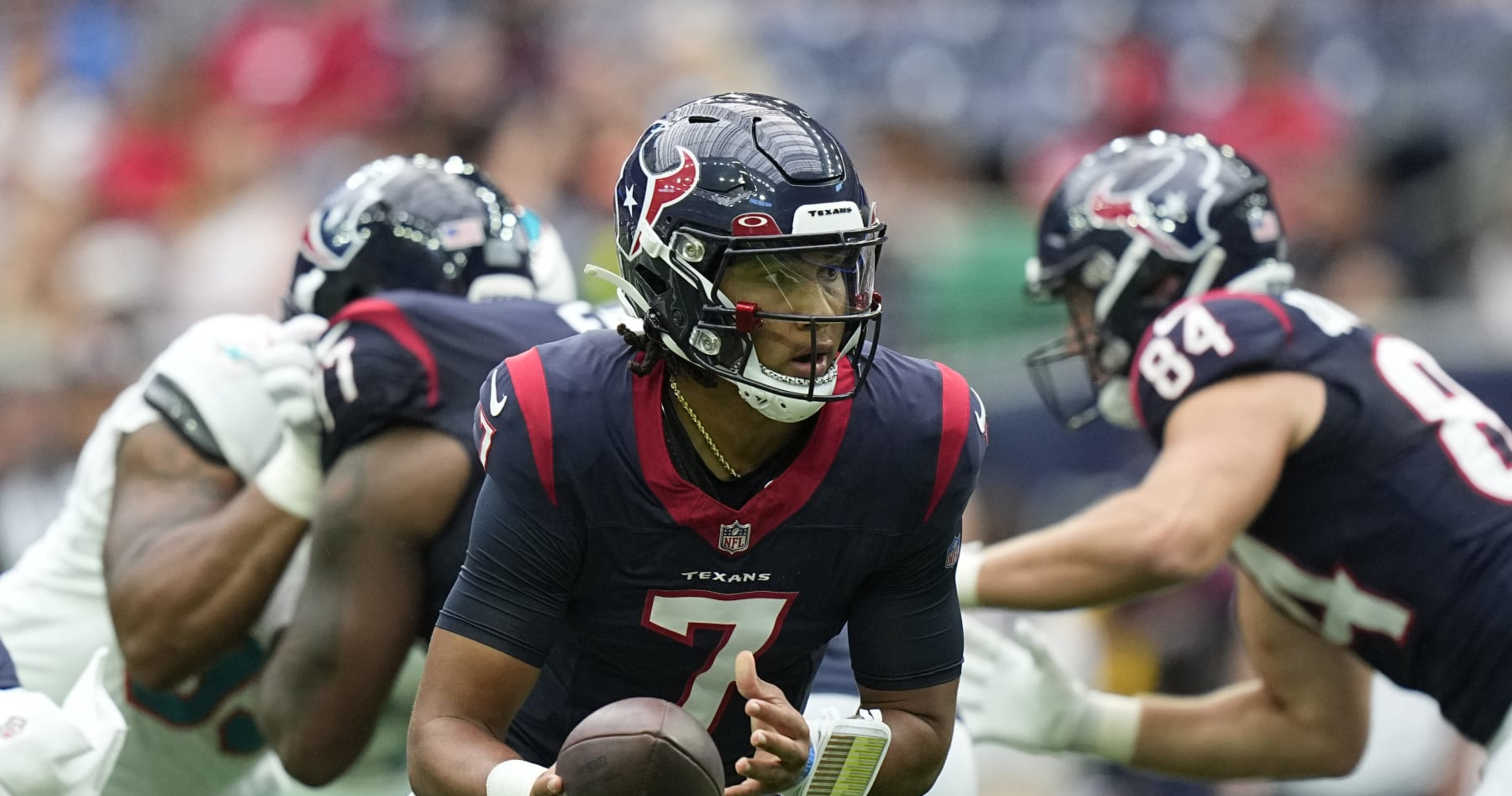 New Orleans, USA. 27th Aug, 2023. Houston Texans quarterback C.J. Stroud  (7) attempts a pass while facing a heavy pass rush from New Orleans Saints  defensive ends Tanoh Kpassagnon (92) and Carl