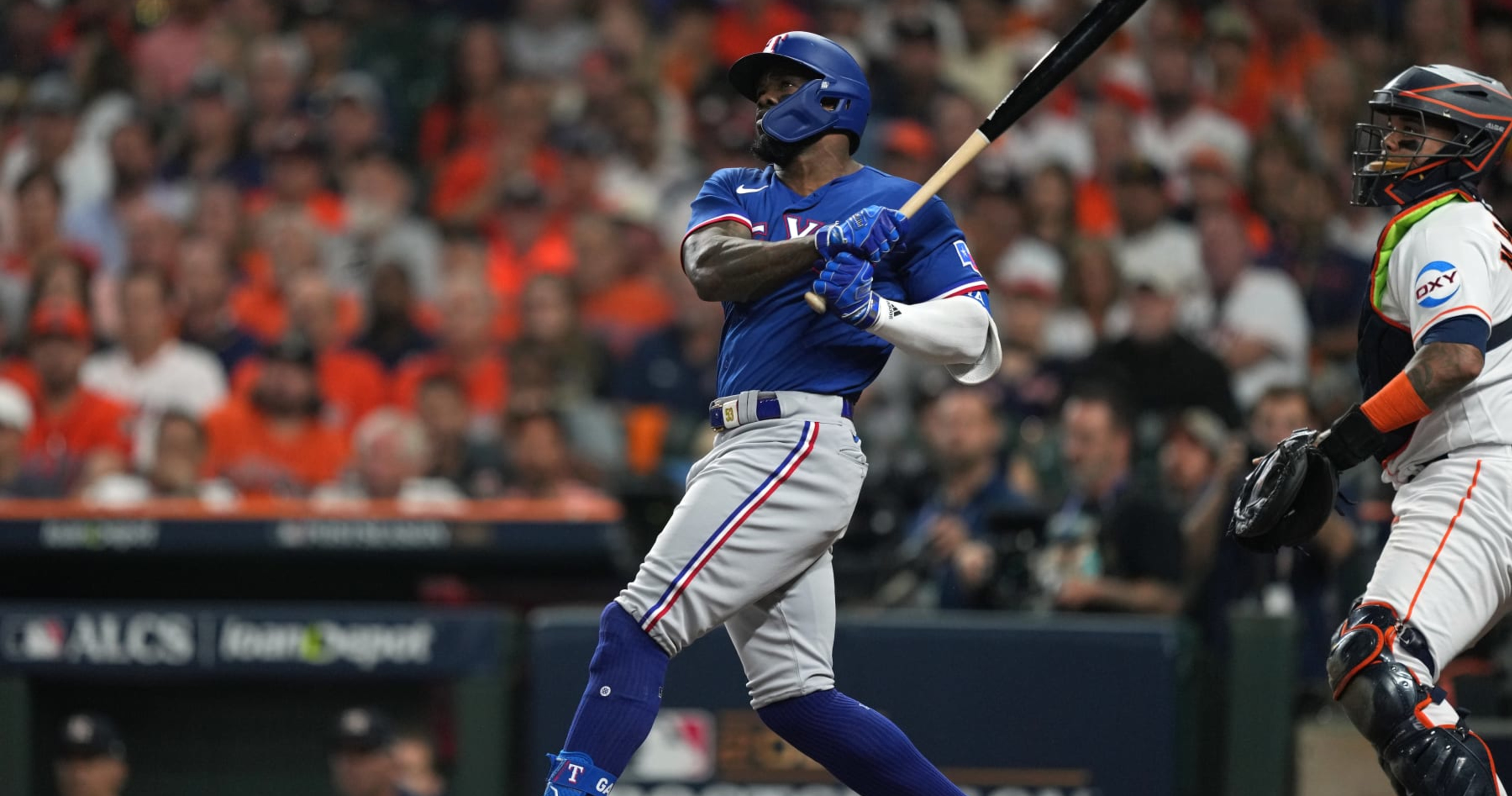 Adolis Garcia of the Texas Rangers celebrates after hitting a solo News  Photo - Getty Images