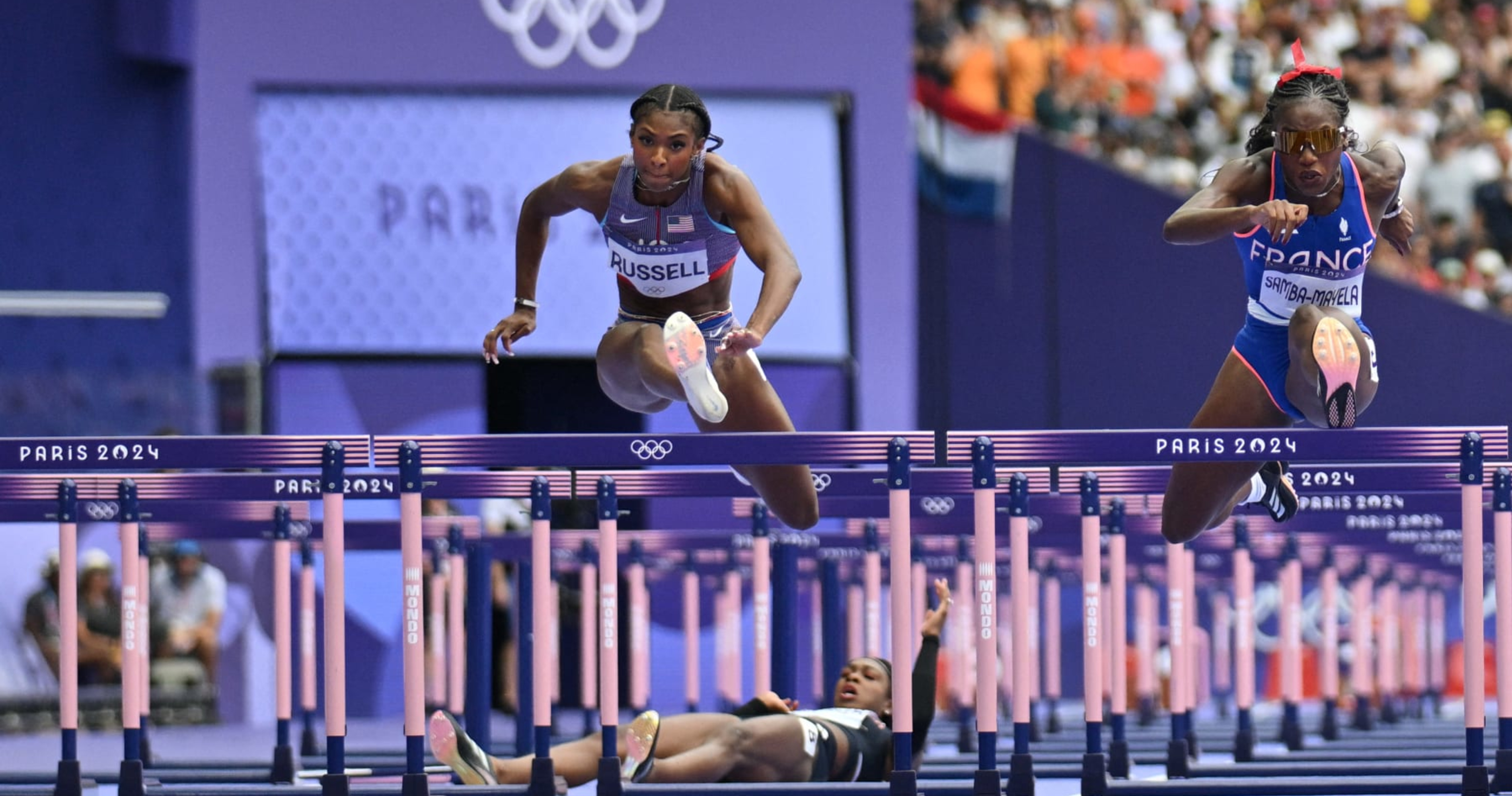 USA's Masai Russell Wins Gold Medal in Women's 100m Hurdles Photo