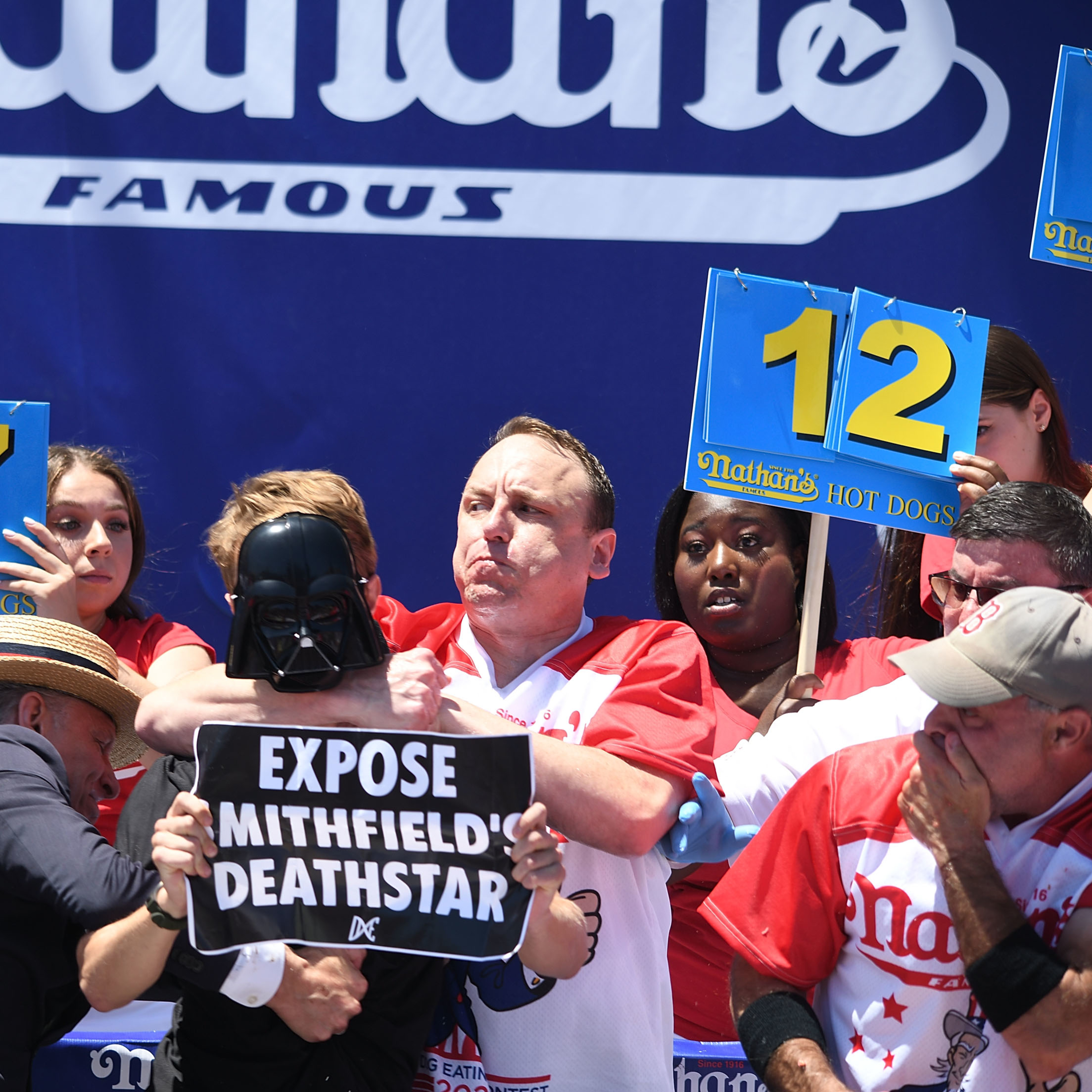 Joey Chestnut Has Altercation with Protestor During Nathan's Hot Dog Eating Cont..