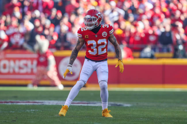 Kansas City Chiefs safety Tyrann Mathieu (32) interacts with a fan