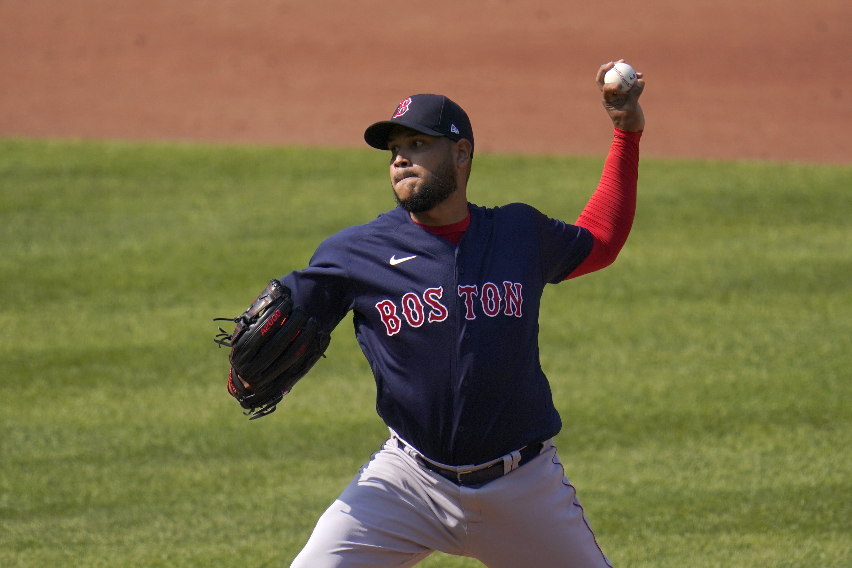 Boston Red Sox starting pitcher Eduardo Rodriguez throws a pitch against the Baltimore Orioles during the first inning of a baseball game, Thursday, April 8, 2021, on Opening Day in Baltimore. (AP Photo/Julio Cortez)