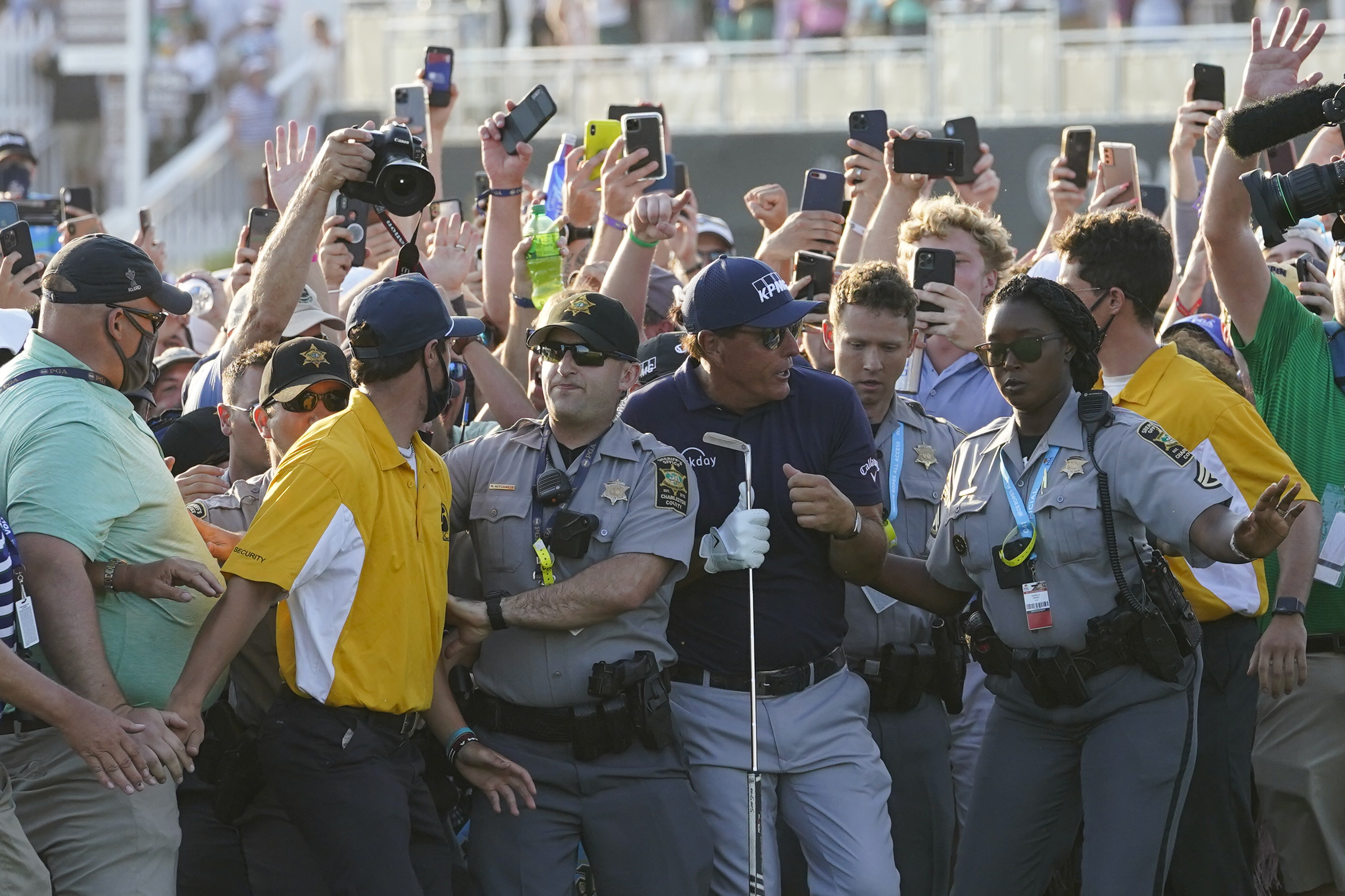 Phil Mickelson wades through fans on the 18th fairway during the final round at the PGA Championship golf tournament on the Ocean Course, Sunday, May 23, 2021, in Kiawah Island, S.C. (AP Photo/Matt York)