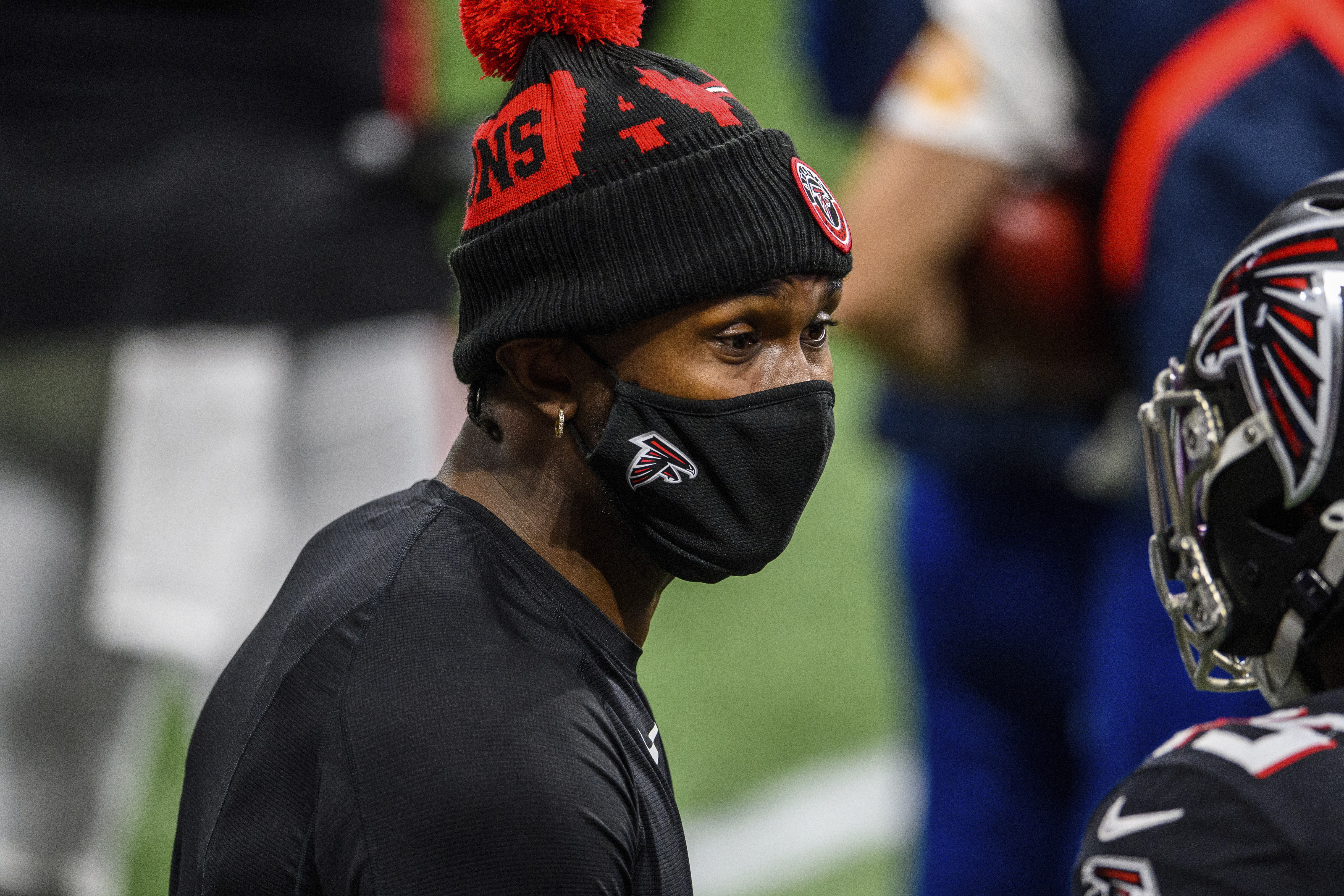 FILE - Atlanta Falcons wide receiver Julio Jones (11) speaks to a teammate during the second half of an NFL football game against the Tampa Bay Buccaneers, in Atlanta, in this Sunday, Dec. 20, 2020, file photo.  The Atlanta Falcons began their offseason training program Tuesday, May 25, 2021, without longtime star receiver Julio Jones, who apparently has no intention of returning to a rebuilding team that is still struggling to get under the salary cap. (AP Photo/Danny Karnik, File)