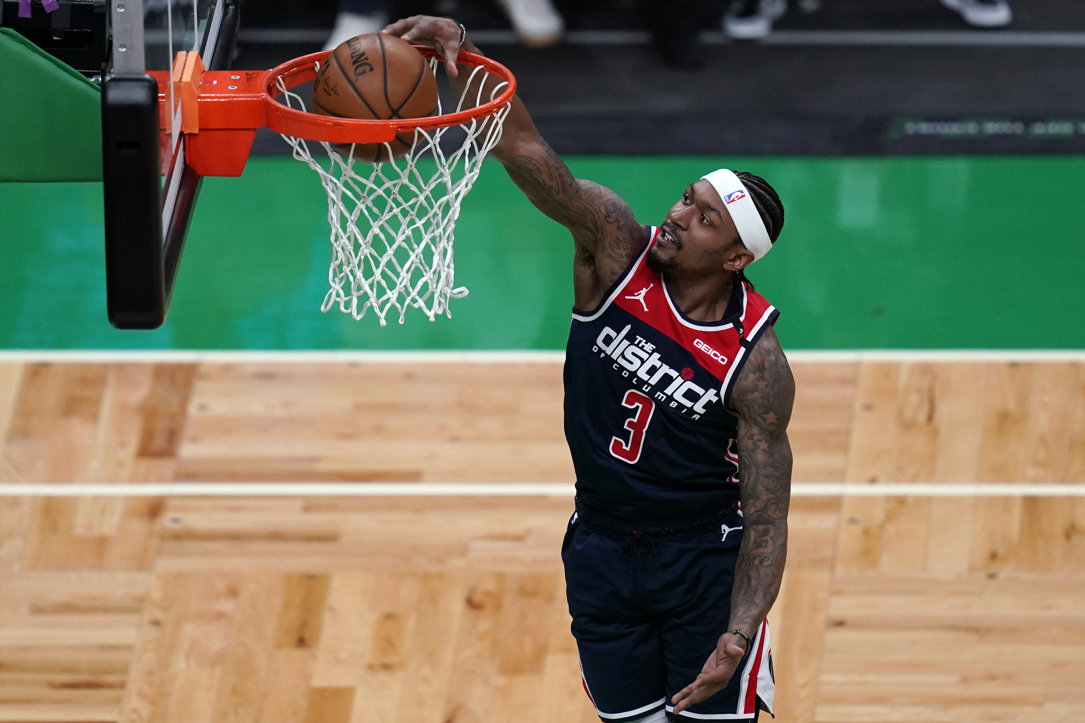 Washington Wizards guard Bradley Beal (3) dunks against the Boston Celtics during the first half of an NBA basketball Eastern Conference play-in game Tuesday, May 18, 2021, in Boston. (AP Photo/Charles Krupa)
