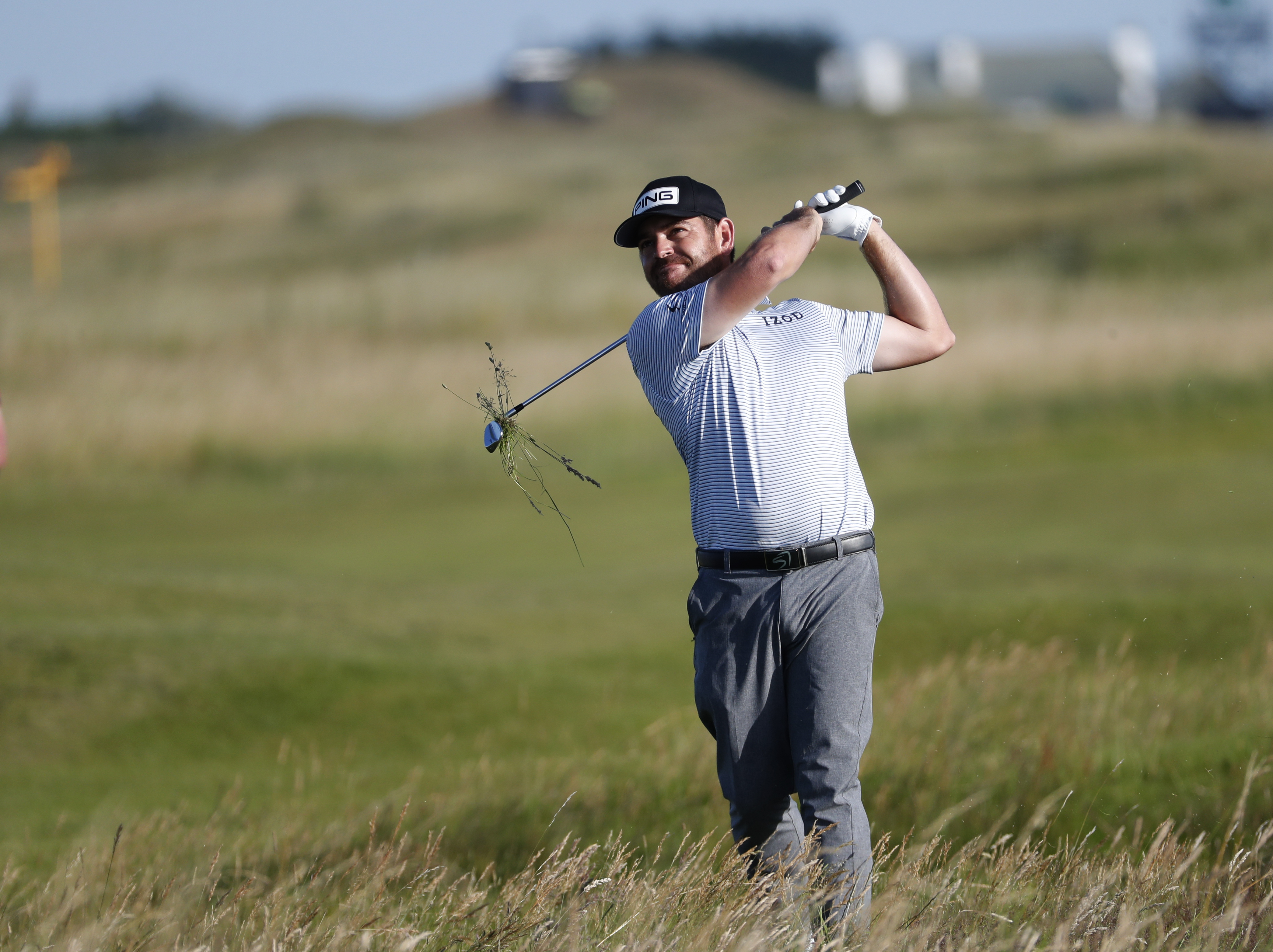 South Africa's Louis Oosthuizen plays out of the rough on the 13th hole during the third round of the British Open Golf Championship at Royal St George's golf course Sandwich, England, Saturday, July 17, 2021. (AP Photo/Peter Morrison)