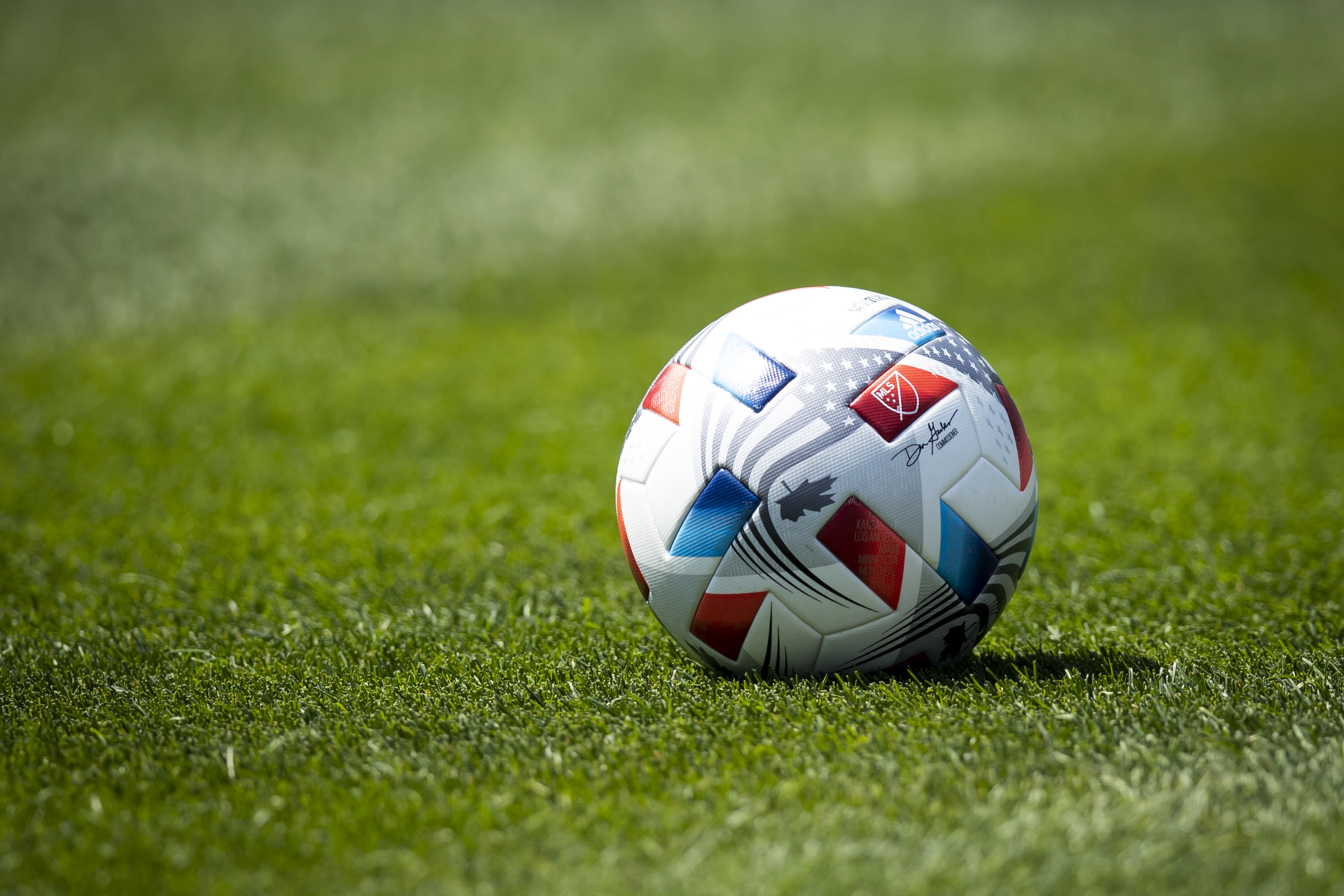 NEW YORK, NY - APRIL 24: One of the Adidas game balls with the logo to MLS and signature by Don Garber Commissioner of Major League Soccer on the pitch for the home opener match against between New York City FC and FC Cincinnati at Yankee Stadium on April 24, 2021 in New York City. (Photo by Ira L. Black - Corbis/Getty Images)