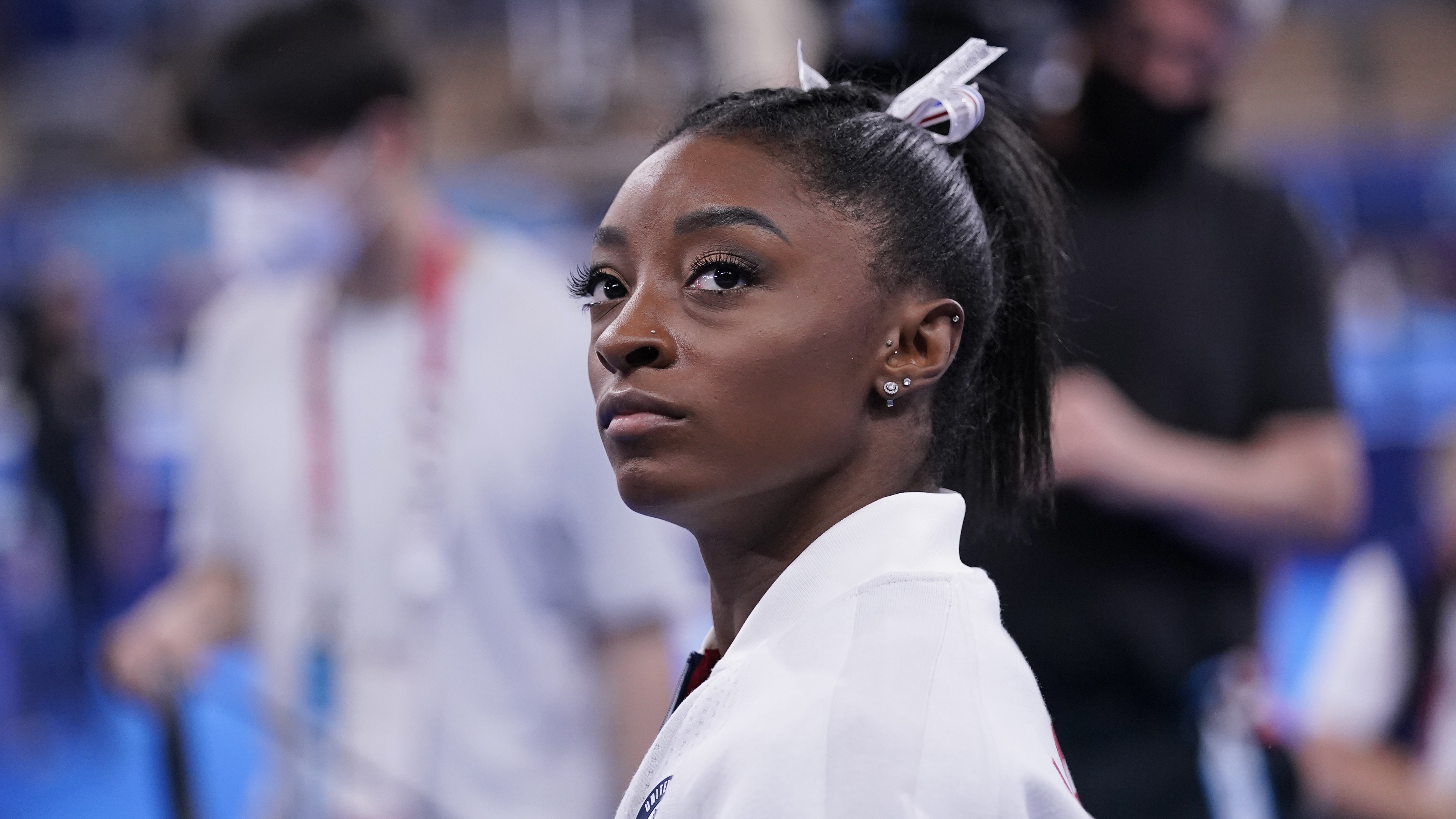 Simone Biles, of the United States, waits for her turn to perform during the artistic gymnastics women's final at the 2020 Summer Olympics, Tuesday, July 27, 2021, in Tokyo. (AP Photo/Gregory Bull)